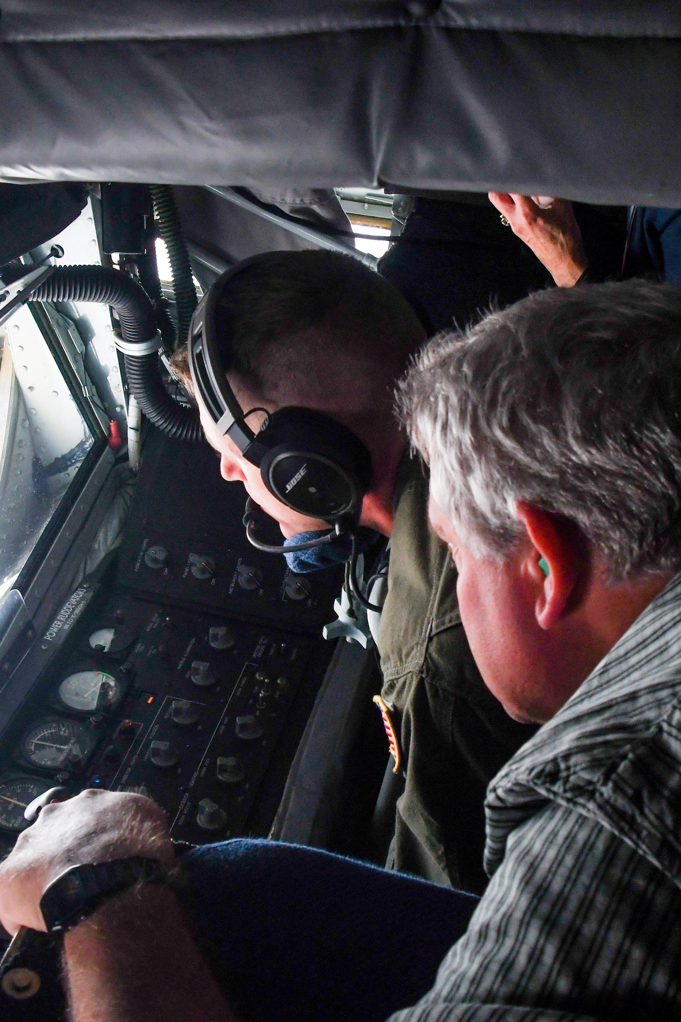 Pastor John Moden, from the Eastside Church of God, watches U.S. Air Force Senior Airman James Marshall, a boom operator assigned to the 434th Air Refueling Wing, Grissom Air Reserve Base, Ind., refuel a B-52 Stratofortress in-air on a flight out of Barksdale Air Force Base, La. on May 13, 2016. The 307th Bomb Wing at Barksdale hosted a Clergy Day where Airmen invited their clergy to see the Wing, learn about the mission and fly in the KC-135. (U.S. Air Force photo by Master Sgt. Dachelle Melville/Released)