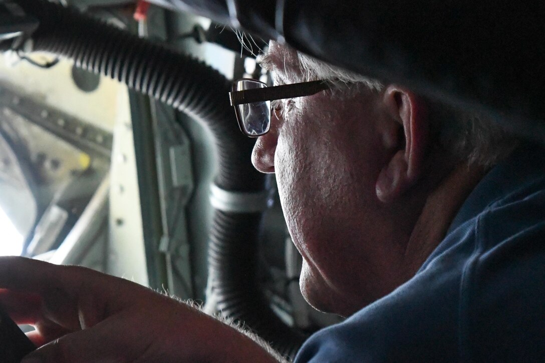 A local clergy member gets a bird’s eye view from the boom operator’s position in the back of a KC-135 Stratotanker during a flight out of Barksdale Air Force Base, La. on May 13, 2016.  The 307th Bomb Wing’s Reserve Airmen invited their clergy to see the Wing, learn about the Reserve mission and fly in the KC-135 to see an in-air refueling of a B-52 Stratofortress. (U.S. Air Force photo by Master Sgt. Dachelle Melville/Released)