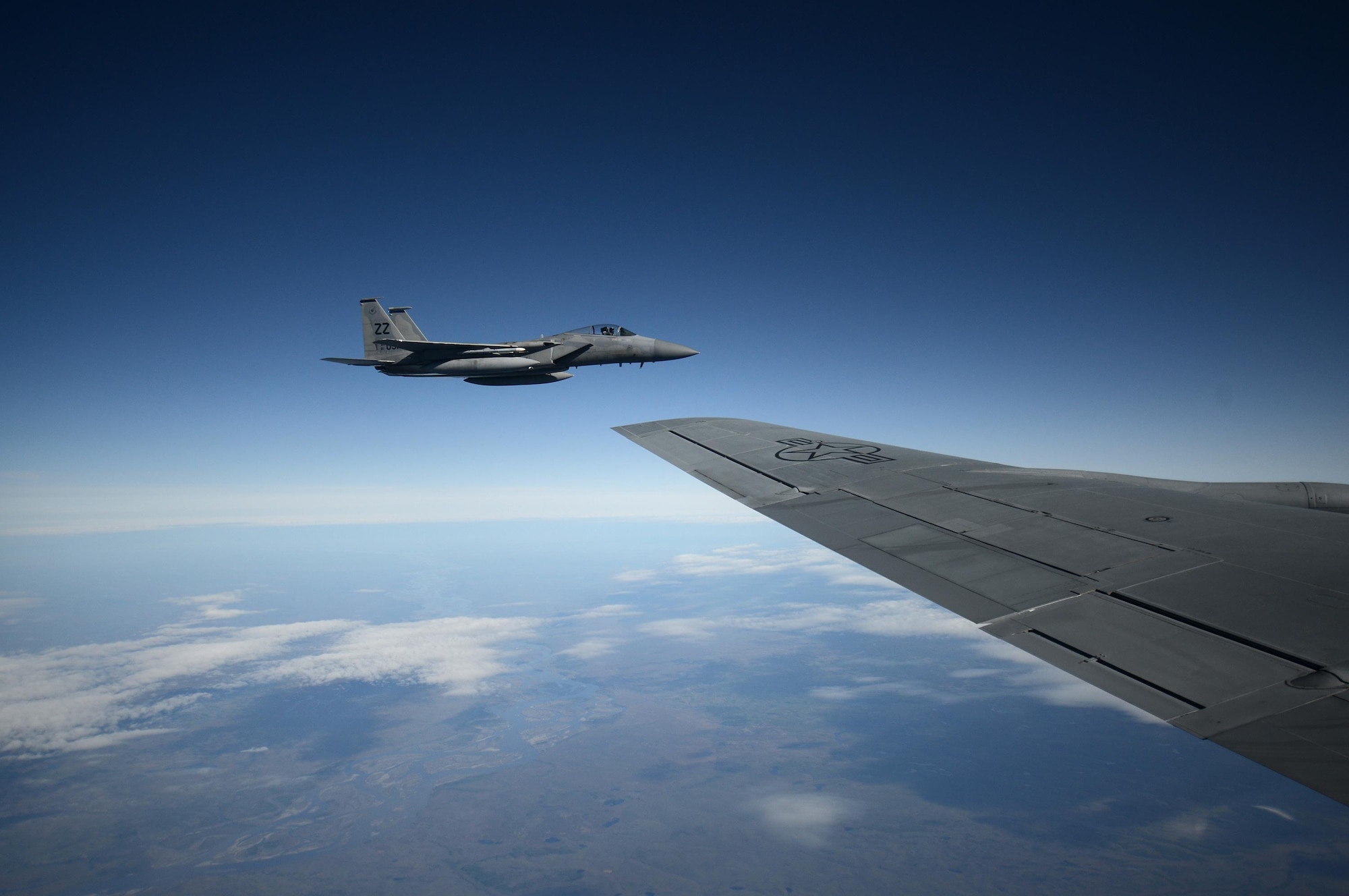 An F-15C Eagle aircraft with the 67th Fighter Squadron, Kadena Air Base, Japan, parallels alongside a KC-135 Stratotanker from the 909th Air Refueling Squadron, Kadena Air Base, Japan, to begin an inflight refueling procedure May 12, 2016, inside the Joint Pacific Alaska Range Complex. More than 75 aircraft and 1,400 participants took part in RED FLAG-Alaska which was mostly exercised throughout the JPARC. RF-A is a series of Pacific Air Forces commander-directed field training exercises for U.S. and partner nation forces, enabling joint and international units to exchange tactics, techniques and procedures while improving interoperability in a realistic threat environment. (U.S. Air Force photo by Tech. Sgt. Steven R. Doty)