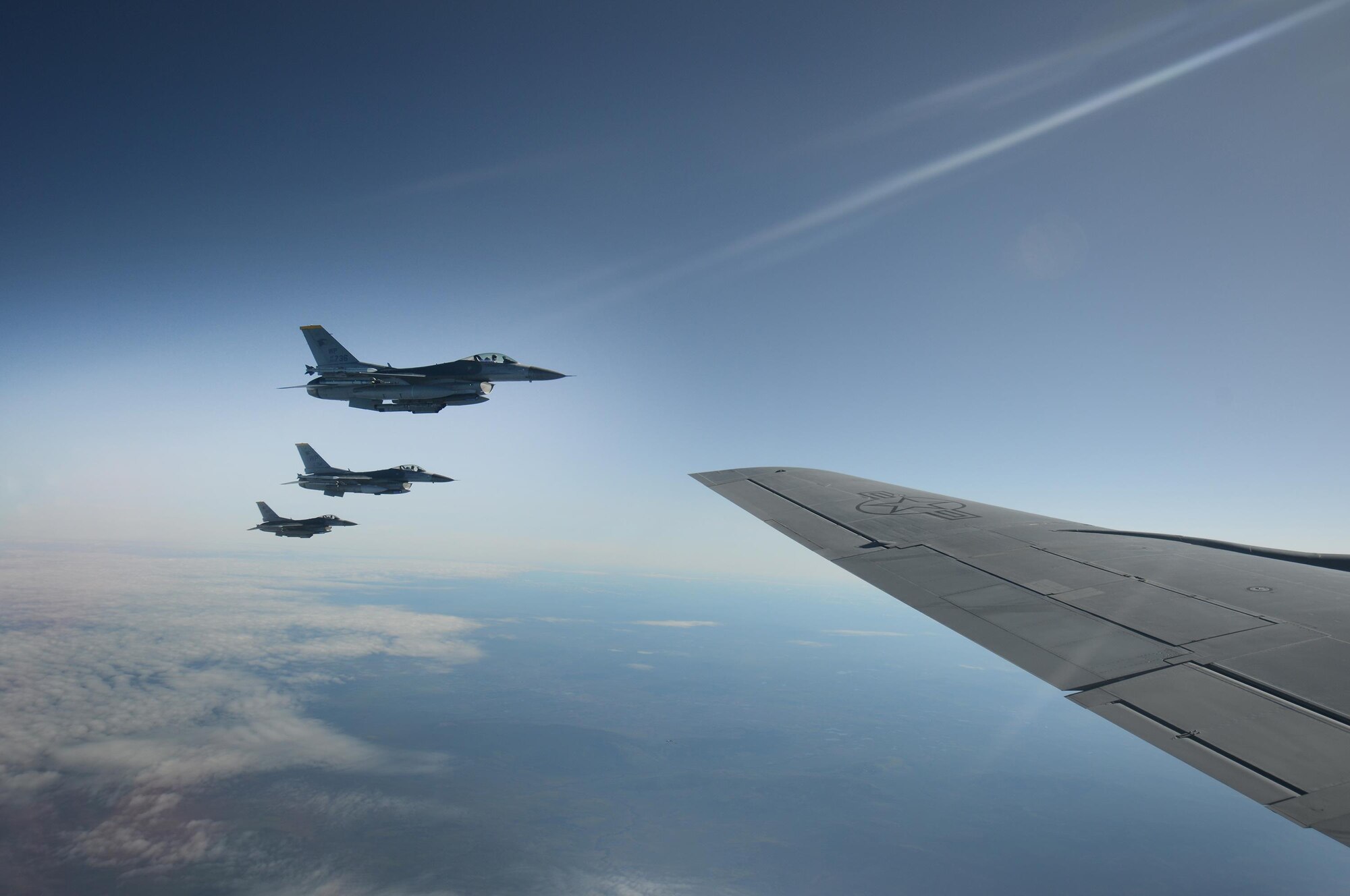 Three F-16 Fighting Falcon’s with the 80th Fighter Squadron, Kunsan Air Base, Republic of Korea, fly alongside a KC-135 Stratotanker from the 909th Air Refueling Squadron, Kadena Air Base, Japan, May 12, 2016, inside the Joint Pacific Alaska Range Complex. The JPARC provides a realistic training environment and allows commanders to train for full spectrum engagements, ranging from individual skills to complex, large-scale joint engagements. (U.S. Air Force photo by Tech. Sgt. Steven R. Doty)