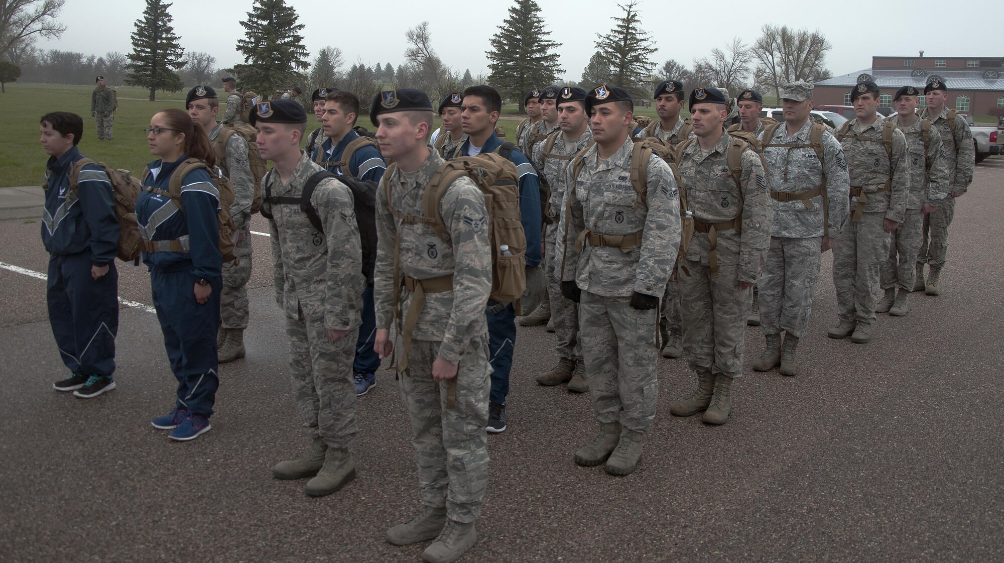 Ninetieth Security Forces Group defenders stand in formation May 16, 2016, before starting the memorial 5-kilometer ruck-run in honor of National Police Week on F.E. Warren Air Force Base, Wyo. Half of the defenders marched in the formation while the other half ran or walked the course. (U.S. Air Force photo by Senior Airman Brandon Valle)
