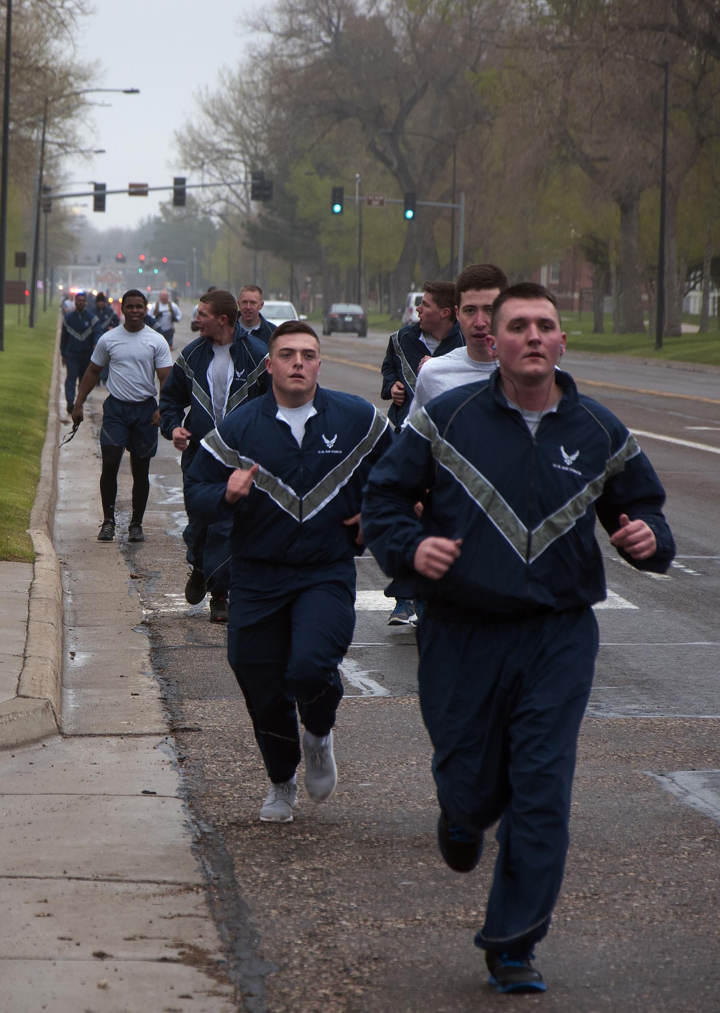 Ninetieth Security Forces Group defenders run down Randall Avenue on F.E. Warren Air Force Base, Wyo., May 16, 2016, during a memorial 5-kilometer ruck-run in honor of National Police Week. The 5K was the first of four events planned by the 90th SFG to remember and honor those who serve as police, civilians and in the military. (U.S. Air Force photo by Senior Airman Brandon Valle)