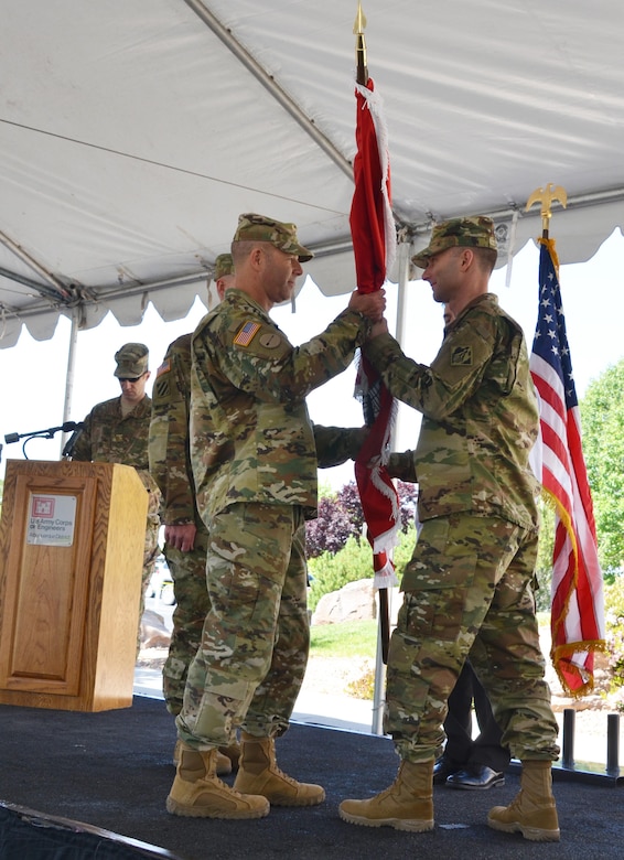 ALBUQUERQUE, N.M. – Outgoing Albuquerque District Commander Lt. Col. Patrick Dagon hands the U.S. Army Corps of Engineer flag to South Pacific Division Deputy Commander Col. Eric McFadden during the District’s formal change of command ceremony, May 12, 2016.  The ceremony symbolizes the transfer of command responsibility from one individual to another and is physically represented by the passing of the flag from the old commander to the new. Traditionally the next senior commander performs the transfer.  
