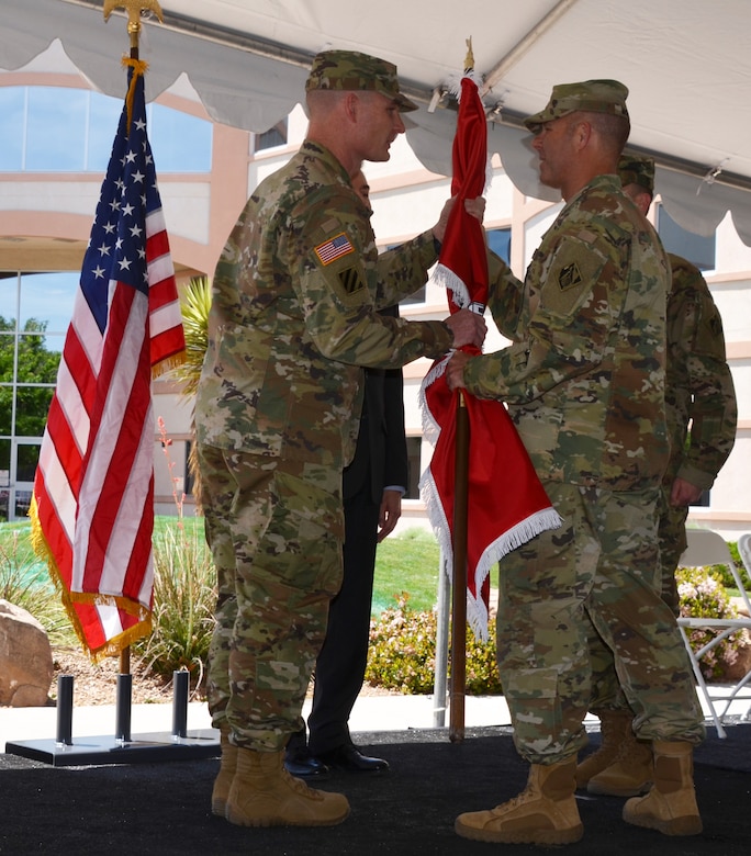 ALBUQUERQUE, N.M. – South Pacific Division Deputy Commander Col. Eric McFadden hands the U.S. Army Corps of Engineer flag to Incoming Albuquerque District Commander Lt. Col. James Booth during the District’s formal change of command ceremony, May 12, 2016.  The ceremony symbolizes the transfer of command responsibility from one individual to another and is physically represented by the passing of the flag from the old commander to the new. Traditionally the next senior commander performs the transfer.  
