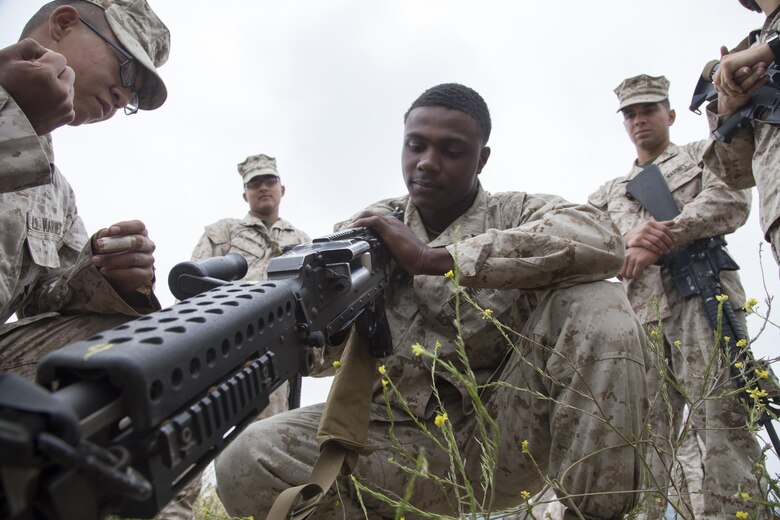 Lance Cpl. Trivelle Graham clears a simulated stoppage on an M240B medium machine gun before a live-fire range aboard Marine Corps Base Camp Pendleton, Calif., May 10, 2016. The Marines participated in the live-fire range to better familiarize themselves with the weapon systems, which were mounted on top of 7-ton Trucks. Graham is a motor transport operator with Combat Logistics Battalion 11, 11th Marine Expeditionary Unit. (U.S. Marine Corps photo by Staff Sgt. Scott McAdam/Released)