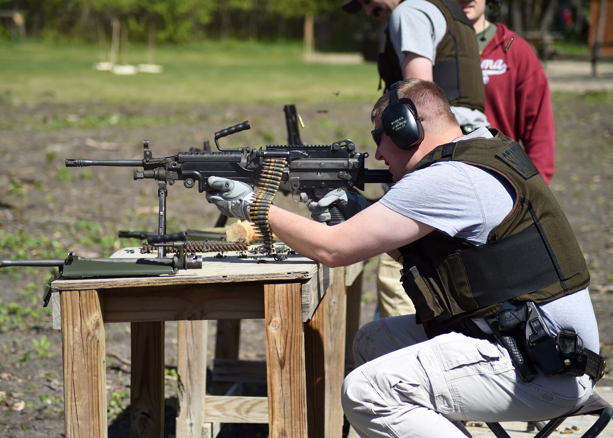 Andrew Cashin, Grand Forks North Dakota Highway Patrol, fires an M249 automatic rifle May 15, 2016, in East Grand Forks, Minn. Cashin joined fellow law enforcement officers for an annual National Police Week shooting competition. (U.S. Air Force photo by Airman 1st Class Ryan Sparks/Released)