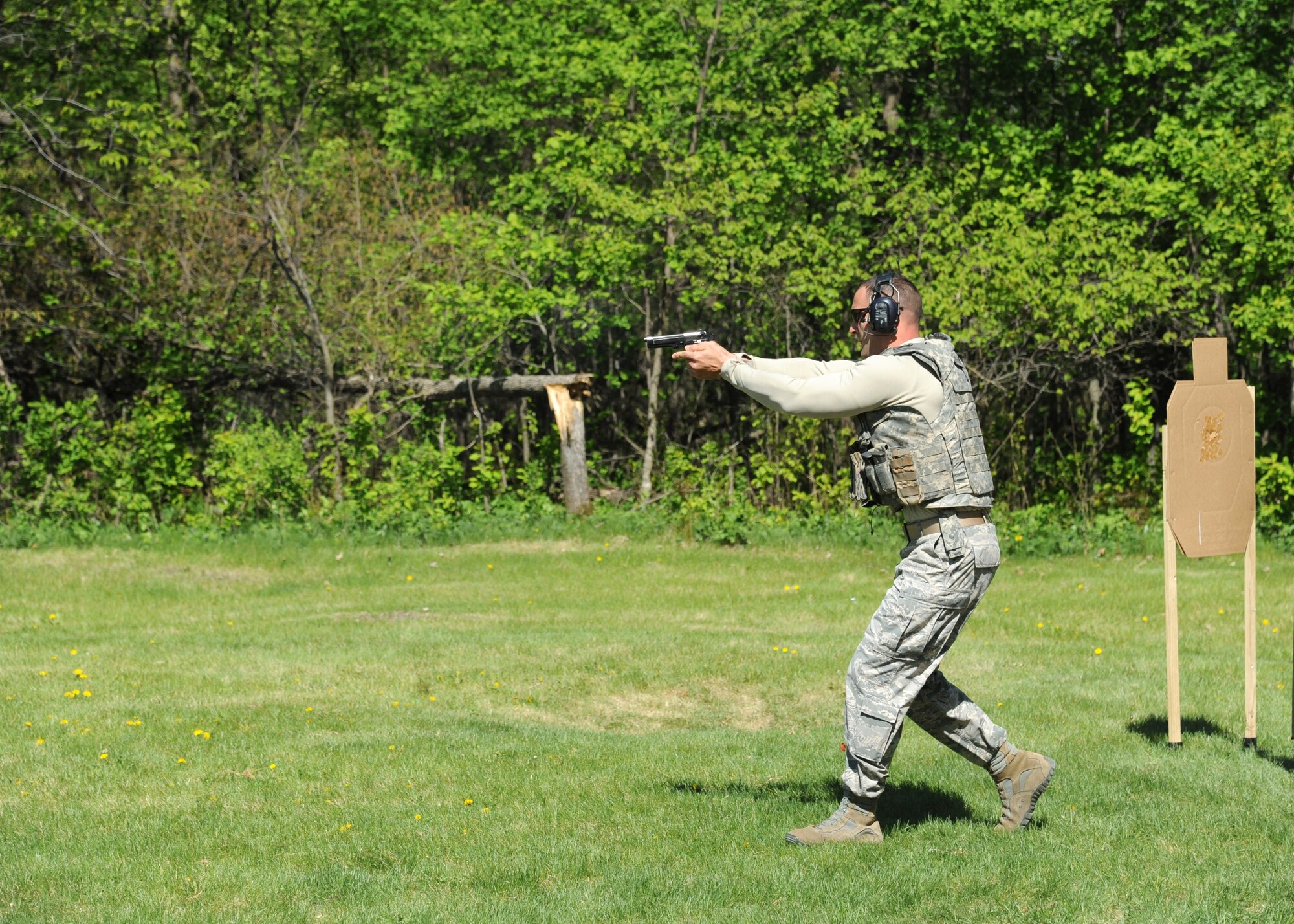 Senior Master Sgt. Brandon Wolfgang, 319th Security Forces Squadron superintendent, moves through the course during an annual National Police Week shooting competition May 15, 2016, in East Grand Forks, Minn. Grand Forks Air Force Base Airmen and local law enforcement kicked off National Police Week with a day of camaraderie and competition. (U.S. Air Force photo by Airman 1st Class Ryan Sparks/Released)