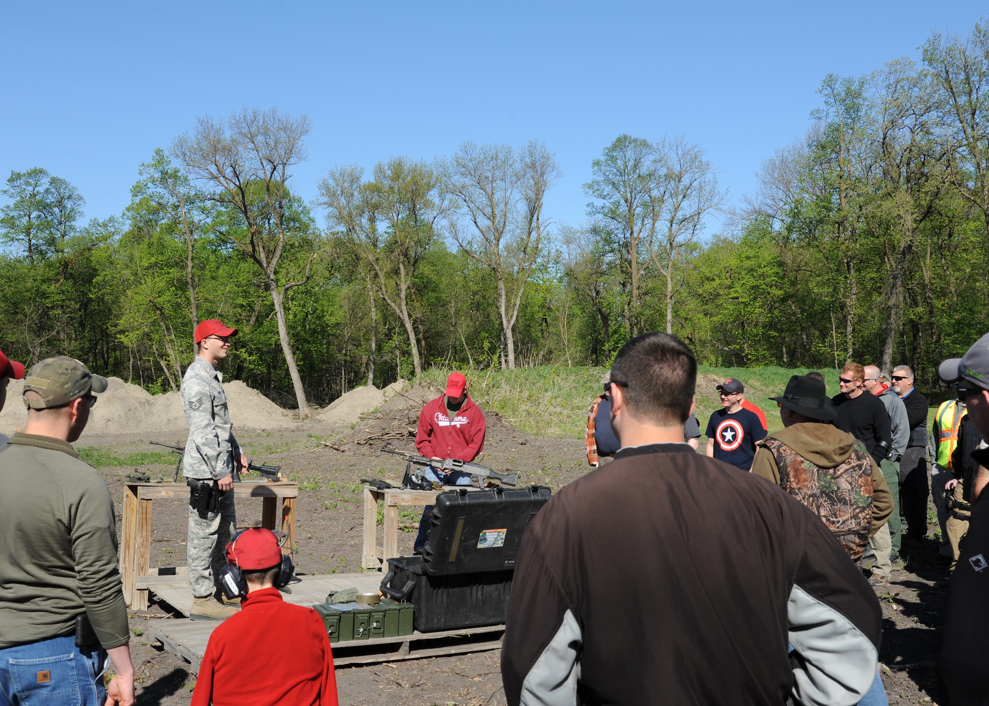 Staff Sgt. Frank Witmer, 319th Security Forces Squadron combat arms instructor, instructs participants during an annual National Police Week shooting competition May 15, 2016, in East Grand Forks, Minn. Witmer and other combat arms instructors provided local law enforcement officers an opportunity to fire belt-fed automatic rifles. (U.S. Air Force photo by Airman 1st Class Ryan Sparks/Released)