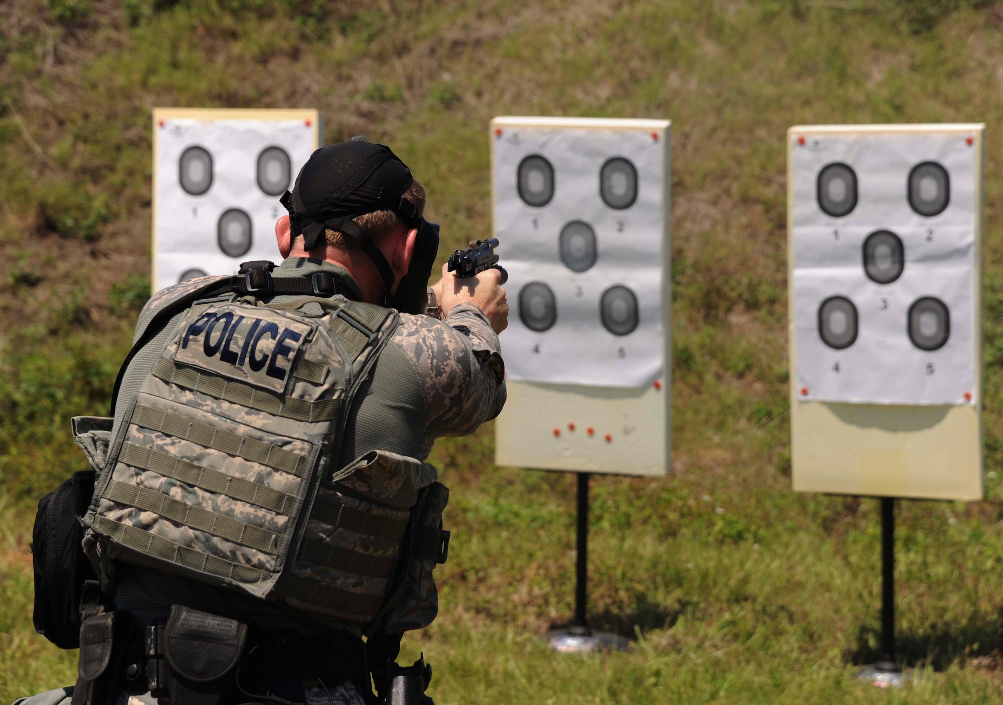 A member of the 6th Security Forces Squadron (SFS) emergency services team (EST) fires at a target during the third annual tactical competition, May 13, 2016 at MacDill Air Force Base, Fla. The 6th SFS EST and local police forces came together for a friendly competition for National Police Week. (U.S. Air Force photo by Airman Adam R. Shanks)