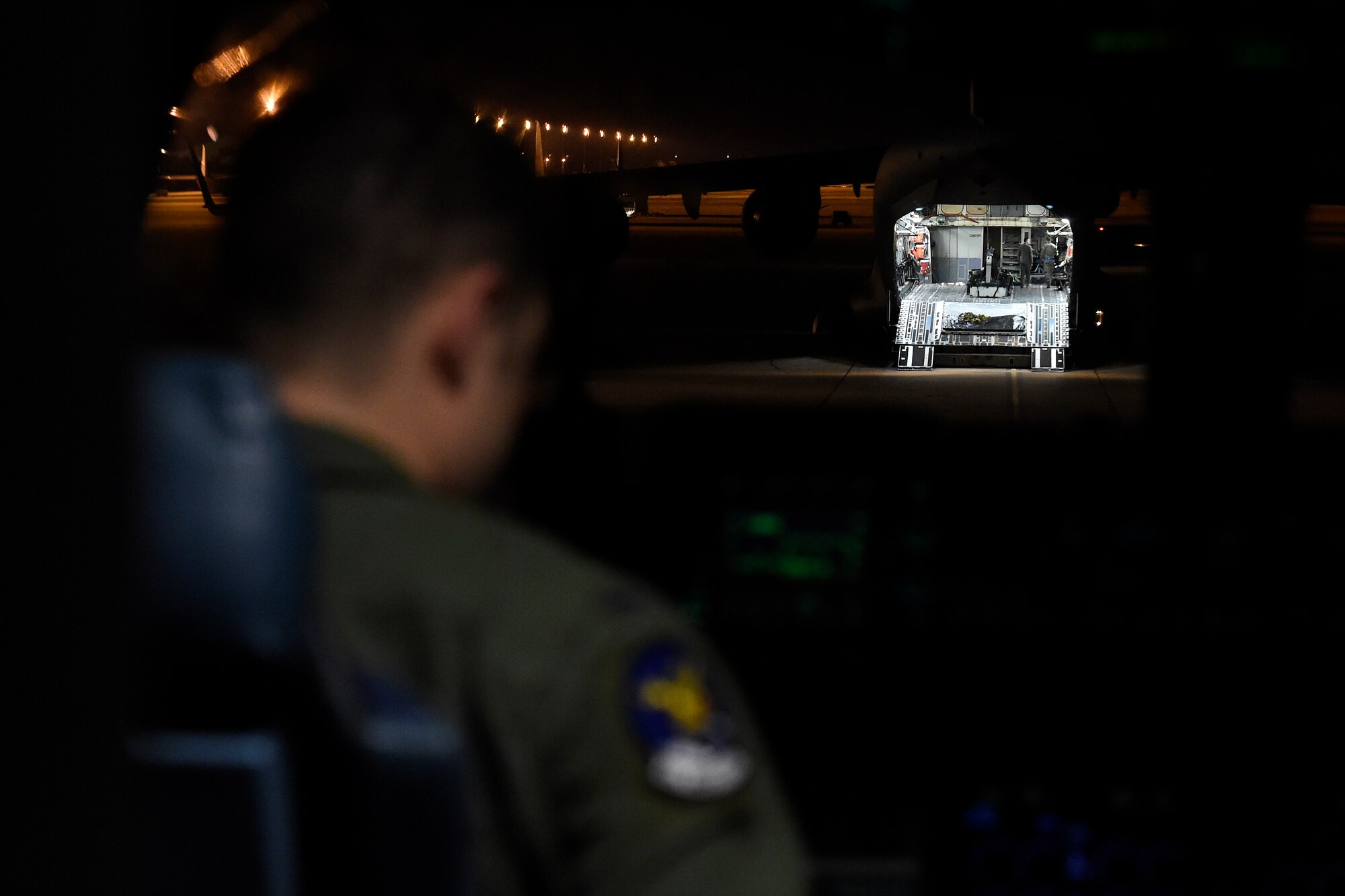 1st Lt. Calvin Woodard, 8th Airlift Squadron C-17 Globemaster III pilot, goes over a preflight checklist at Dyess Air Force Base, Texas, May 3, 2016. Woodard and the C-17 crew stopped at Dyess AFB for fuel after performing air drop operations with the 82nd Airborne Division. (U.S. Air Force photo/ Tech. Sgt. Tim Chacon) 