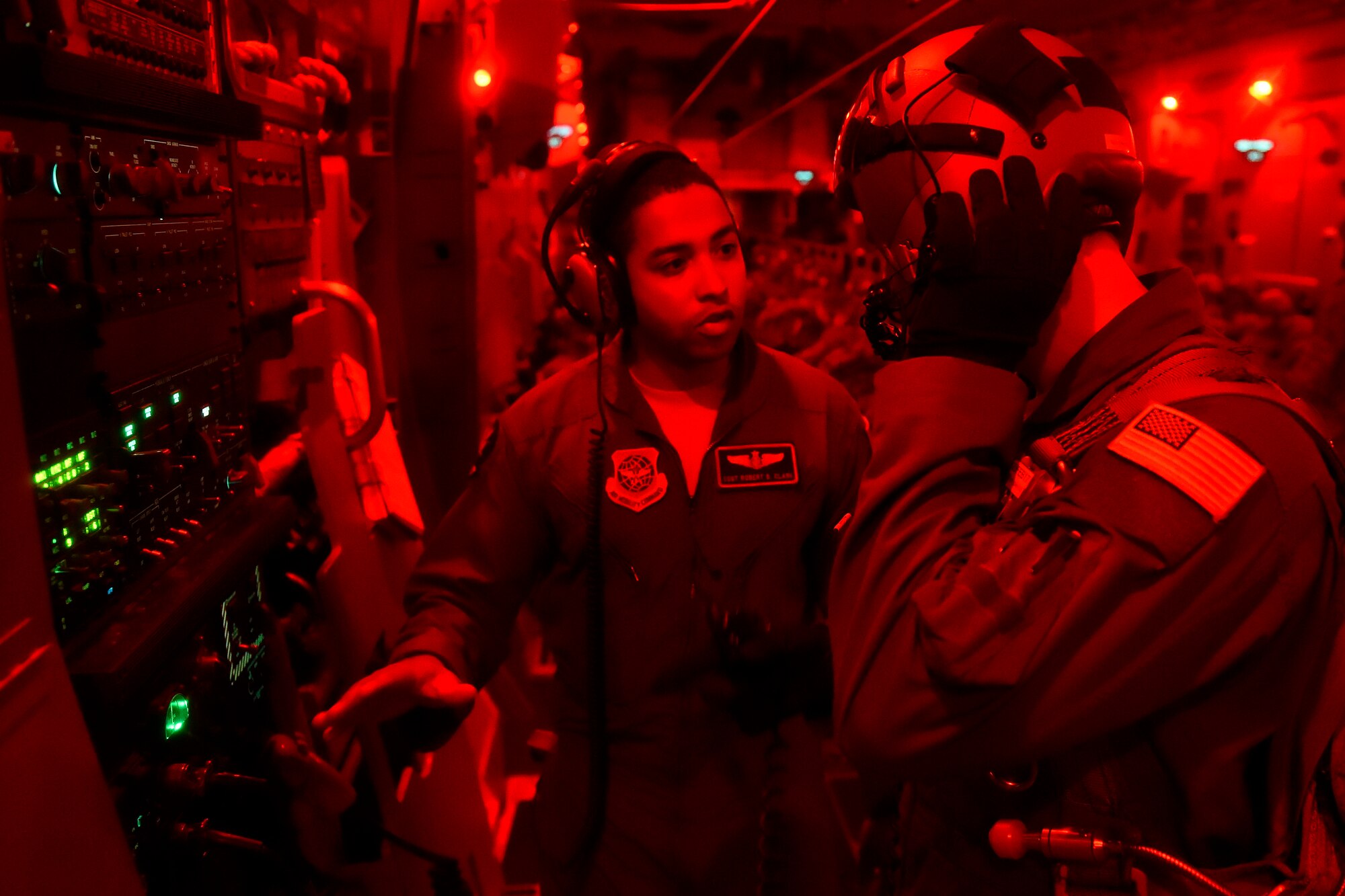 Staff Sgt. Robert Clark (left), 8th Airlift Squadron loadmaster, goes over air drop procedures with Airman 1st Class Jeremy Kosick, 8th AS loadmaster prior to assisting paratroopers from the 82nd Airborne Division conduct a static line jump May 3, 2016, over Texas during a training exercise. The units involved in the exercise trained in: infiltration and exfiltration of personnel and equipment, personnel recovery operations, integration of conventional forces, airborne operations, aerial resupply, long range movements and exercising command and control elements. (U.S. Air Force photo/ Tech. Sgt. Tim Chacon)