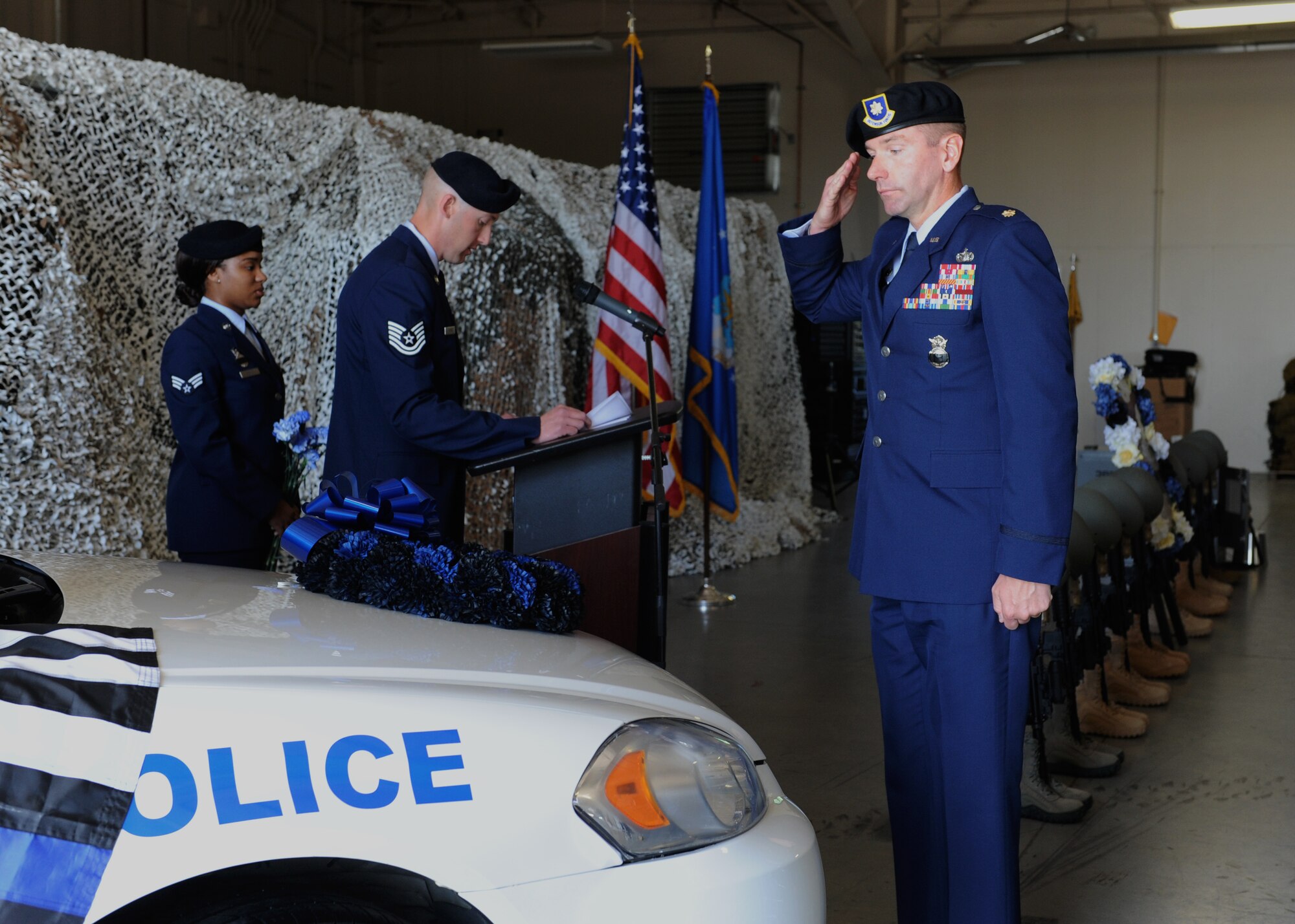 U.S. Air Force Maj. Gregory Bodenstein, 19th Security Forces Squadron commander, salutes a ceremonial wreath during a 2016 National Police Week closing ceremony May 13, 2016, at Little Rock Air Force Base, Ark. The ceremony commemorated law enforcement officers who’ve died in the line of duty. (U.S. Air Force photo by Senior Airman Mercedes Taylor) 