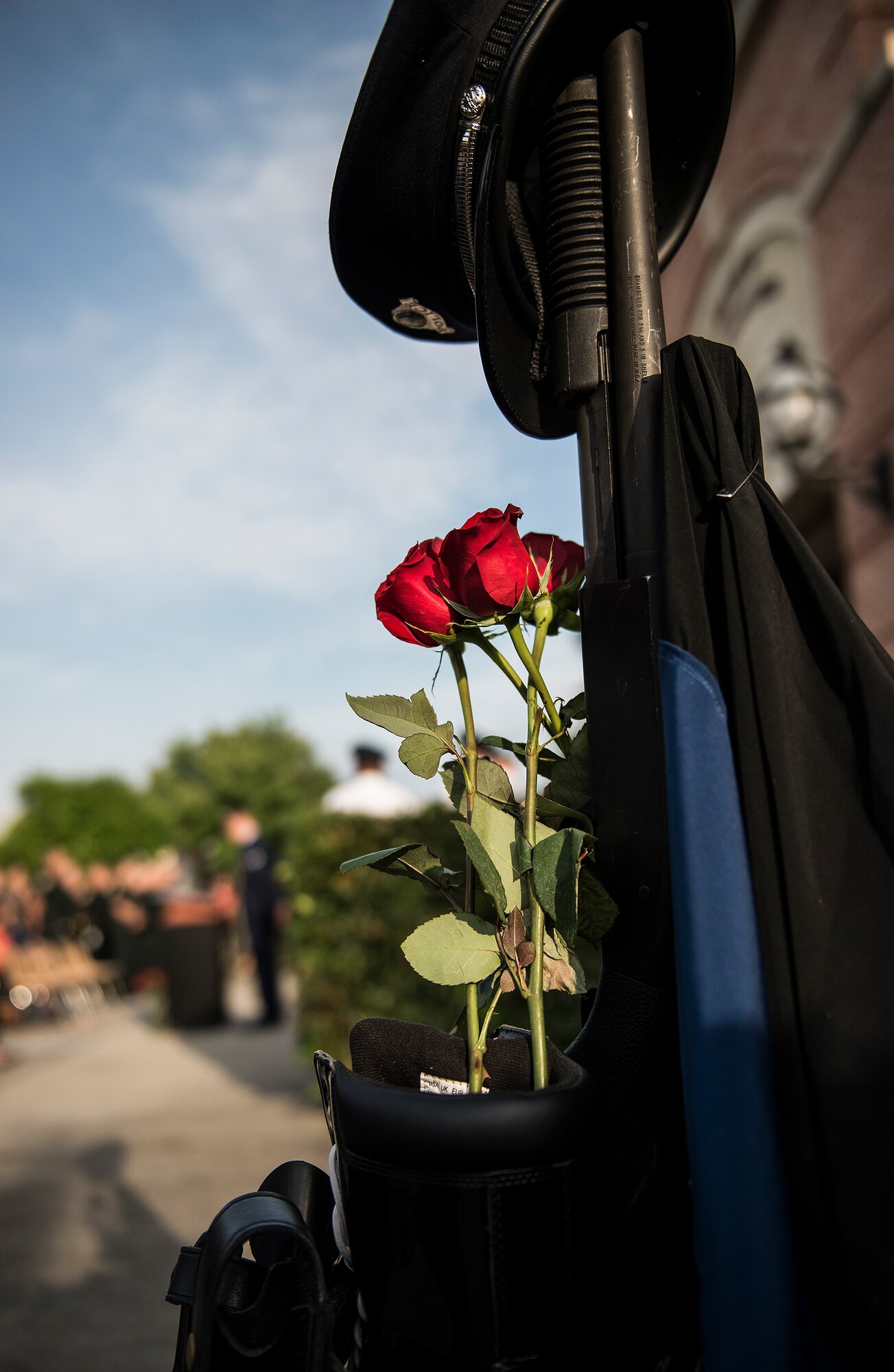 Roses adorn the peace officers’ memorial display as the names of the fallen are read aloud during a ceremony May 16 in Fort Walton Beach, Fla.  The Peace Officers’ Memorial Ceremony was to honor fallen police officers from the previous year by reading their names aloud.  Security forces Airmen from Eglin and Hurlburt Field attended and participated in the event.  The ceremony is one of many events taking place during National Police Week.  (U.S. Air Force photo/Samuel King Jr.)