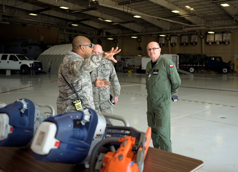 U.S. Air Force Tech. Sgt. Brandon M. Johnson, left, a fire protection craftsman with the 182nd Civil Engineer Squadron, Illinois Air National Guard, explains the unit’s domestic operations capabilities to Polish air force Brig. Gen. Sławomir Żakowski, right, the deputy commander of the Air Operations Center - Air Component Command, in Peoria, Ill., May 13, 2016. Illinois and the Republic of Poland have been colleagues in the National Guard State Partnership Program since 1993. (U.S. Air National Guard photo by Staff Sgt. Lealan Buehrer)