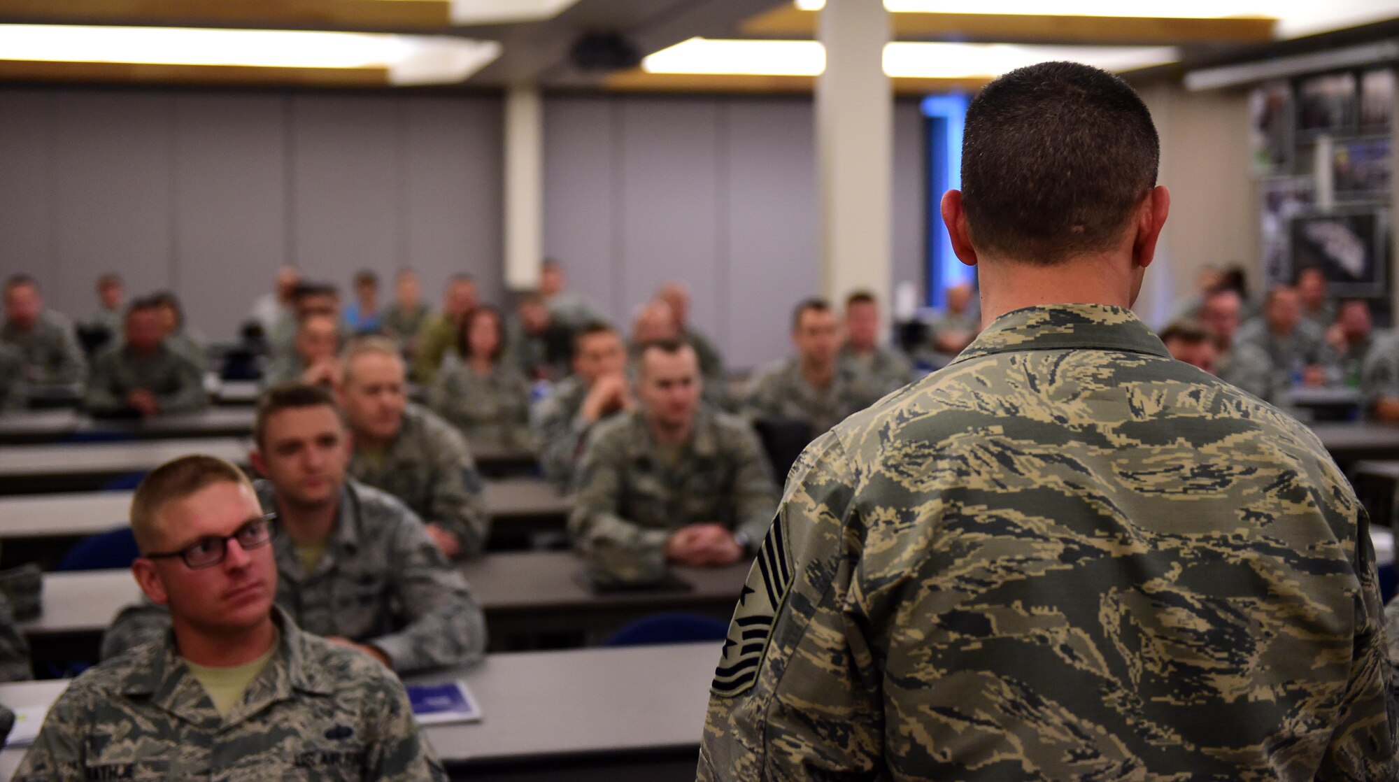 Chief Master Sgt. Brian P. Kruzelnick, 460th Space Wing command chief, speaks with first sergeant symposium attendees May 12, 2016, at the 140th Wing building on Buckley Air Force Base, Colo. The four-day event included lessons taught by current first sergeants, visits from resources such as Airmen and Family Readiness and mental health, and role playing situations from the day-to-day life of a first sergeant. (U.S. Air Force photo by Airman 1st Class Gabrielle Spradling/Released)