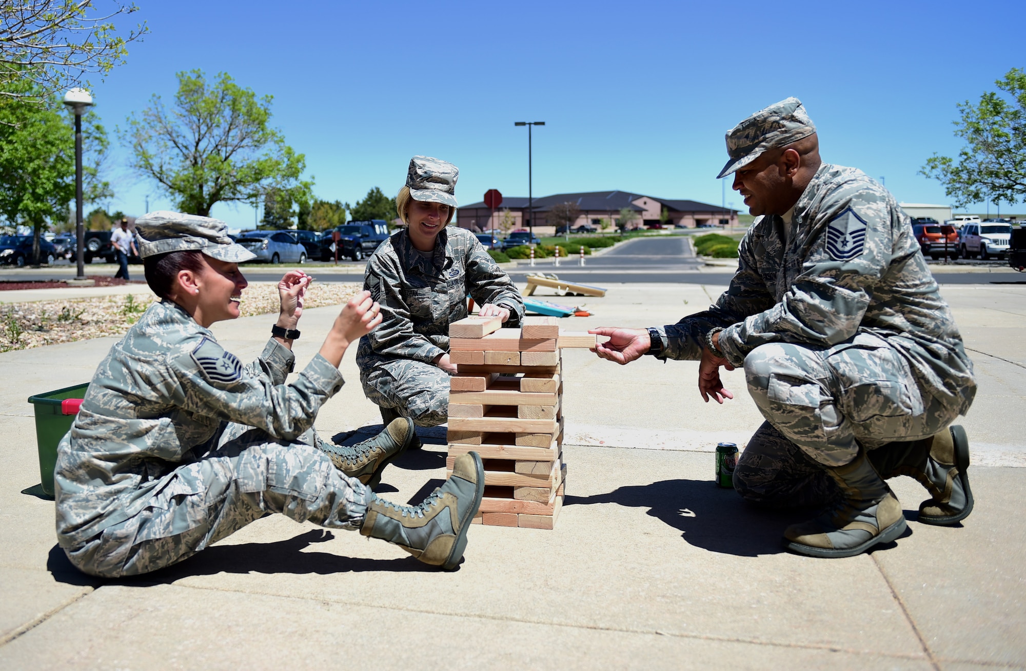 First sergeant symposium participants play Jenga during a break May 12, 2016, at the 140th Wing building on Buckley Air Force Base, Colo. The symposium allowed potential first sergeants four days of one-on-one time with current shirts who have been through difficult situations that make the job what it is and catch a small glimpse into what they could possibly have to handle. (U.S. Air Force photo by Airman 1st Class Gabrielle Spradling/Released)