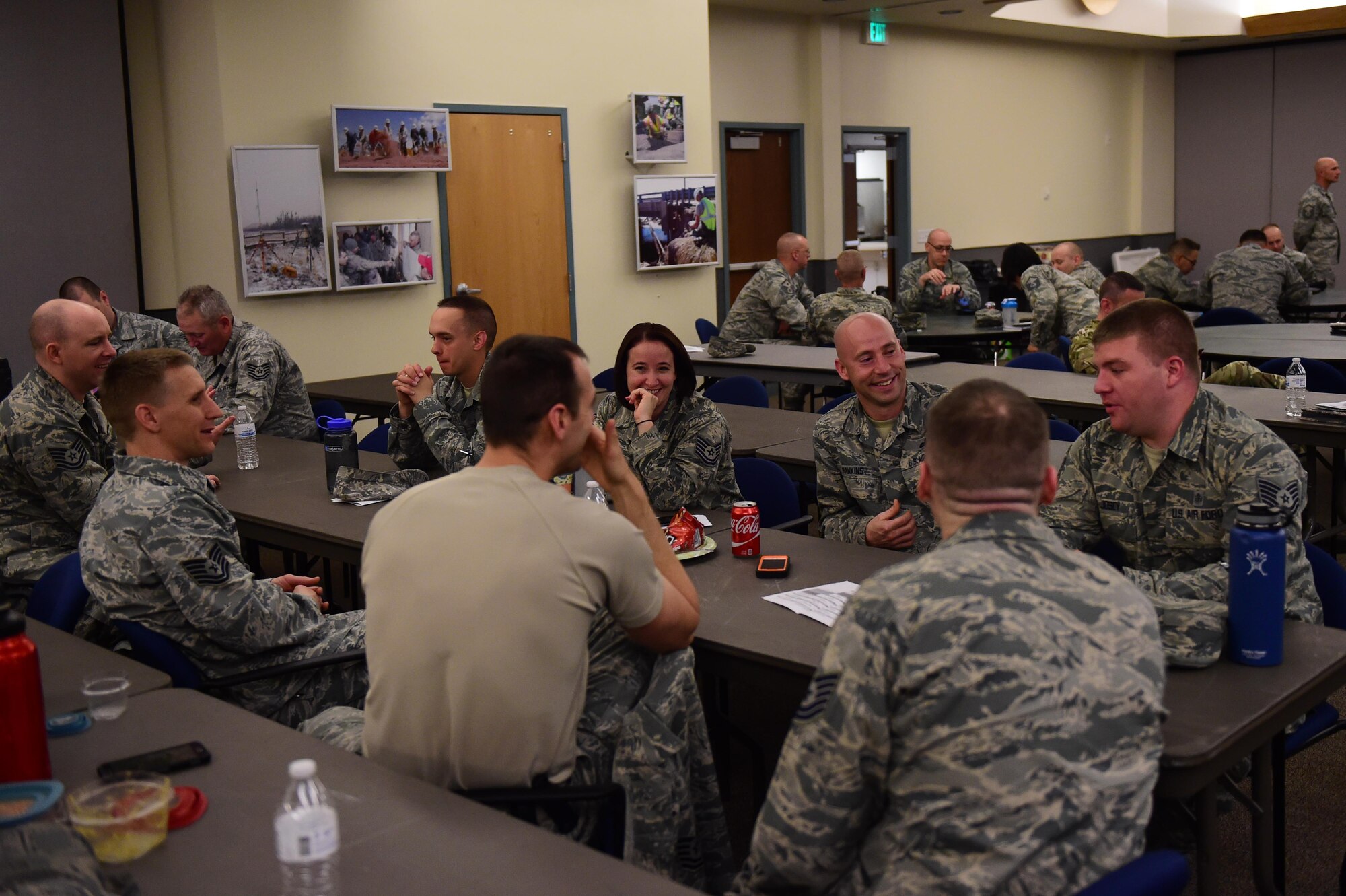 A group of participants talk during a break May 12, 2016, during the first sergeants symposium at the 140th Wing building on Buckley Air Force Base, Colo. The symposium provided an opportunity for technical sergeants and above to become familiar with what the job of a first sergeant is composed of. (U.S. Air Force photo by Airman 1st Class Gabrielle Spradling/Released)