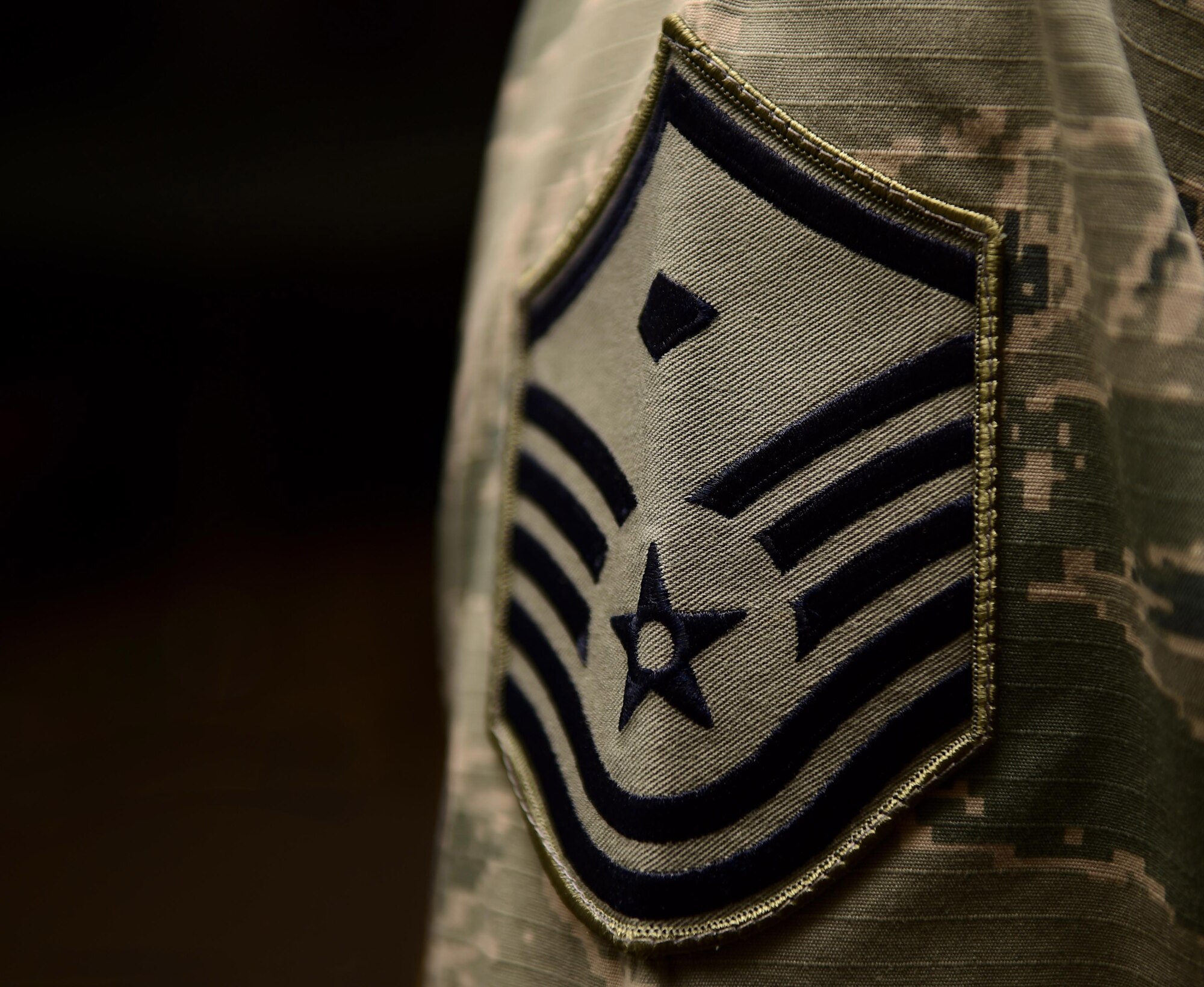 Master Sgt. Troy Drasher, 2 Space Warning Squadron first sergeant, wears a first sergeant diamond May 12, 2016, during the first sergeants symposium at the 140th Wing building on Buckley Air Force Base, Colo. The symposium not only provided potential first sergeants with important insights, but it also allowed current first sergeants an opportunity to prepare their replacements and provide their units with well trained and competent additional duty first sergeants. (U.S. Air Force photo by Airman 1st Class Gabrielle Spradling/Released)