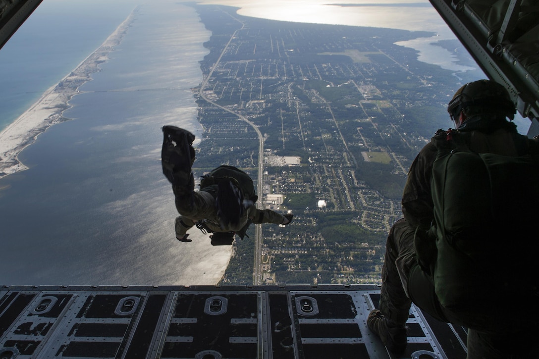 Airmen jump out of an MC-130J Commando II aircraft during Emerald Warrior 16 at Hurlburt Field, Fla., May 4, 2016. The airmen are pararescuemen and combat controllers assigned to the 24th Special Operations Wing. U.S. Special Operations Command sponsors the exercise in which joint special operations forces train for real and emerging worldwide threats. Air Force photo by Staff Sgt. Paul Labbe
