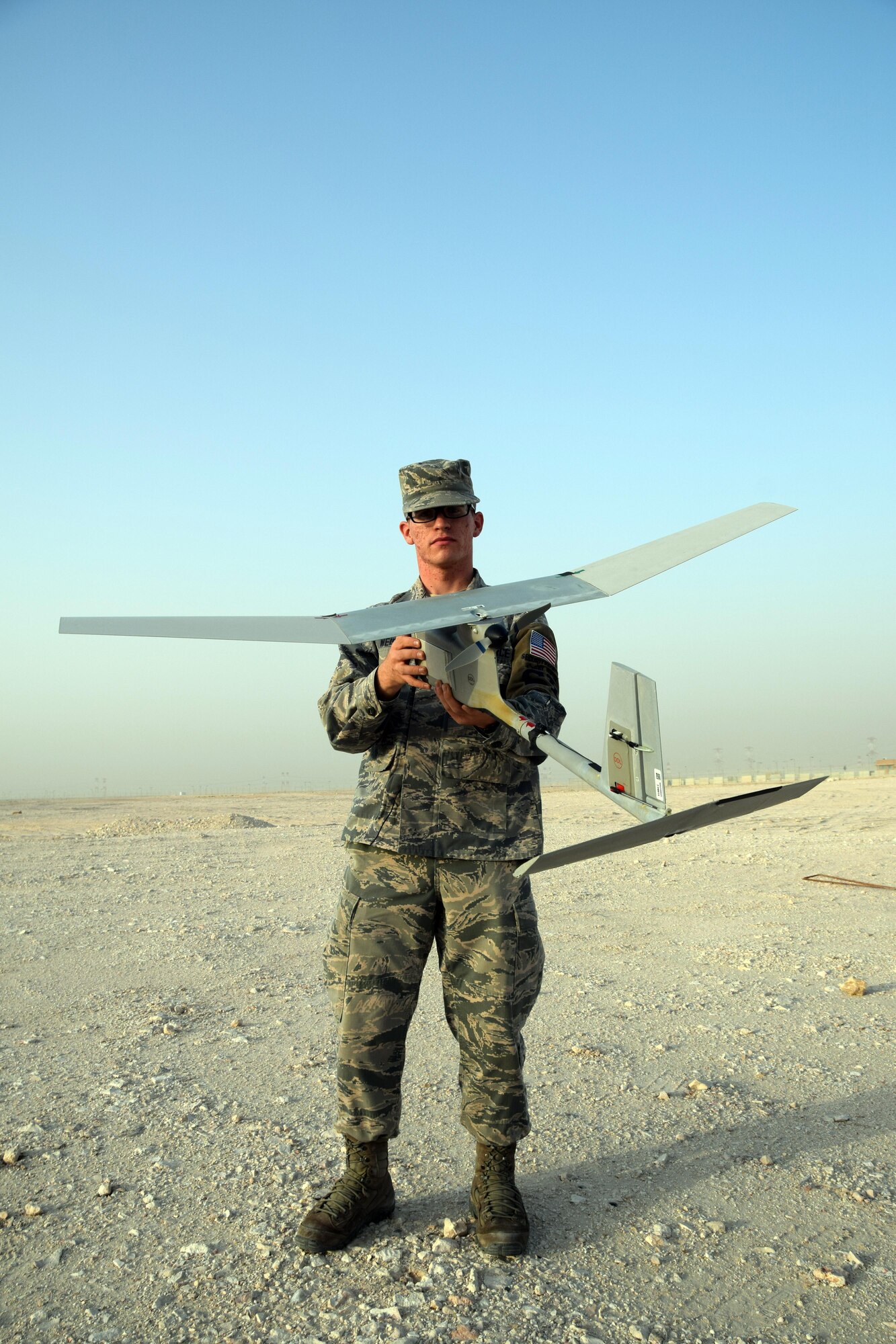 Airman 1st Class Christian Weiss, 379th Expeditionary Security Forces Squadron RQ-11B Raven unmanned aircraft system operator, May 5, 2016, at Al Udeid Air Base, Qatar.  Airman Weiss attended a two-week course to learn to operate and fly the Raven-B, which is used to enhance security patrols around areas of the base . (U.S. Air Force photo by Technical Sgt. Carlos J. Treviño)