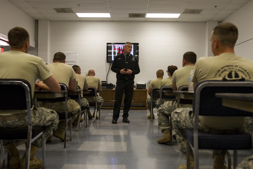 Capt. James Malloy a shift supervisor at the Charles Egeler Reception and Guidance Center instructs U.S. Army Reserve Soldiers assigned to the 303rd Military Police Company in Jackson, Michigan, May 15. The Soldiers were taught inmate control by corrections officer trainers at the local facility. The training is in place to augment their detainee operations in preparation for an upcoming deployment to Guantanamo Bay, Cuba. (U.S. Army photo by Sgt. Audrey Hayes)