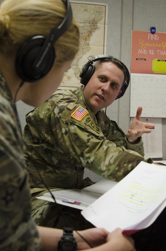 160506-N-HT014-074  FORT MEADE, Md. (May 6, 2016) Army Staff Sgt. Michael Sparks, a basic writing and announcing skills instructor at the Defense Information School on Fort Meade, critiques a student following a voice test at the school. Sparks was selected as the DINFOS Warrior of the Quarter for the first quarter of fiscal 2016.