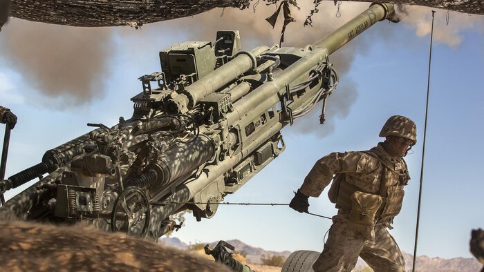 A Marine with 3rd Battalion, 11th Marine Regiment, fire a 155mm M777A2 Lightweight Towed Howitzer in the Lead Mountain Training Area at Marine Corps Air Ground Combat Center Twentynine Palms, California, May 3, 2016. This firing exercise was focused on the ability of the M776 Chrome Tubes to resist the formation of hardened downbore residue when firing the M232A1 Propelling Charge 5H (top zone charges).