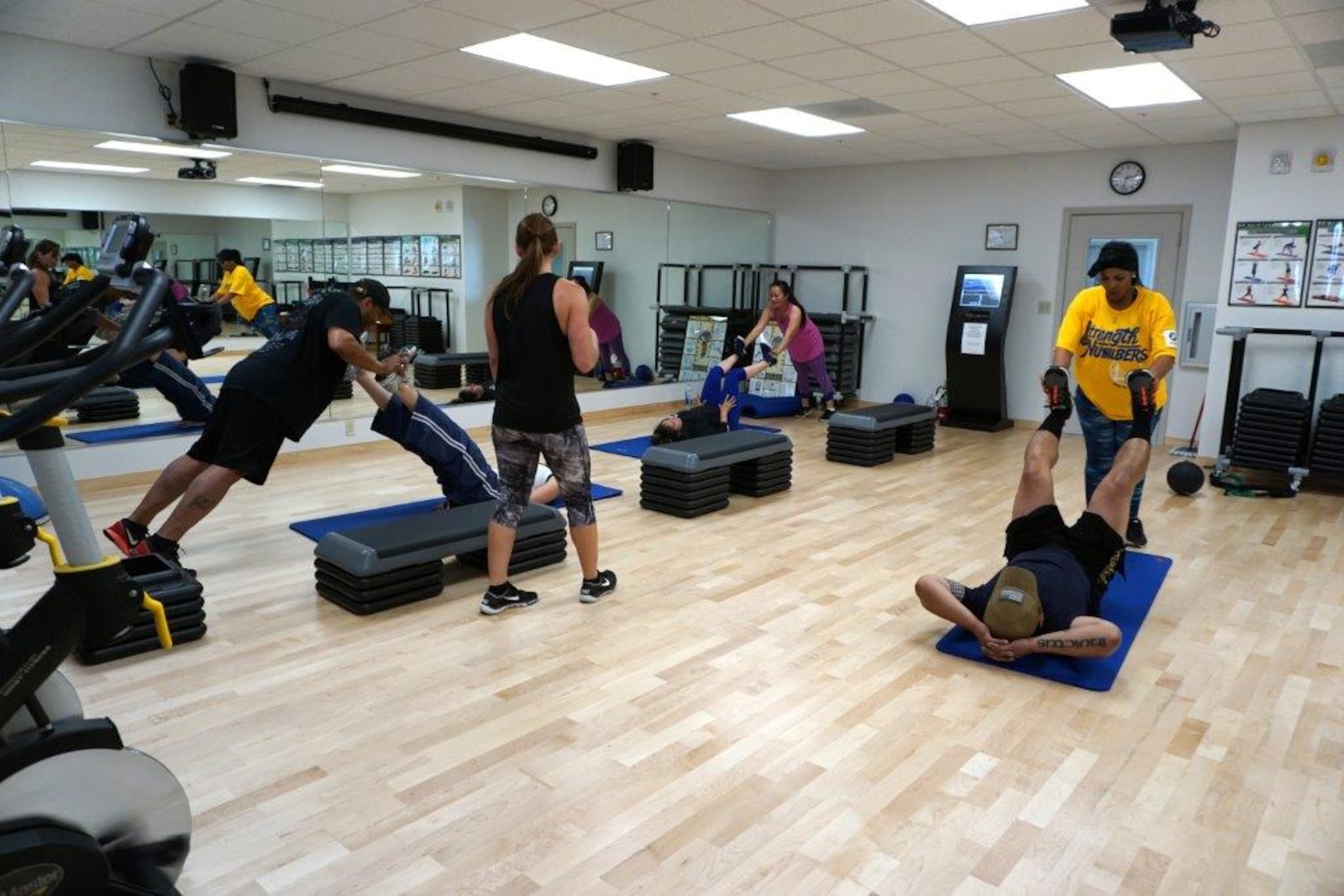 Employees work out at the new Tracy Fitness Center.  