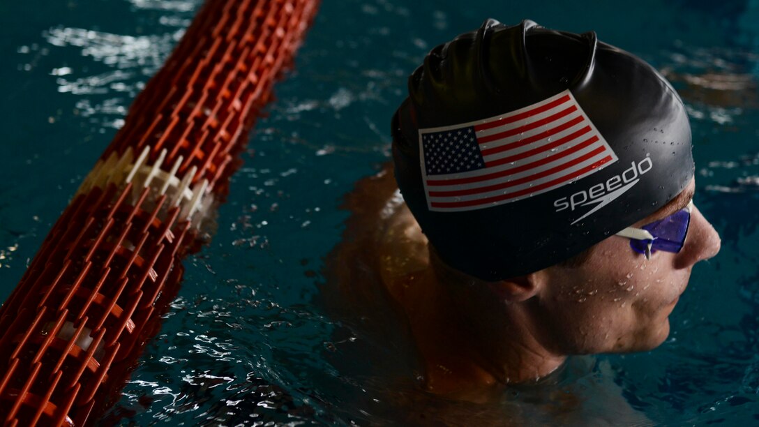 A U.S. Air Forces in Europe Airman rests between laps during a practice swim session, May 10, 2016, in Maniago, Italy. The 2016 Headquarters Allied Air Command Swimming Championship brought together six nations from HQ AIRCOM in the spirit of friendly sporting competition. (U.S. Air Force photo by Senior Airman Austin Harvill/Released)