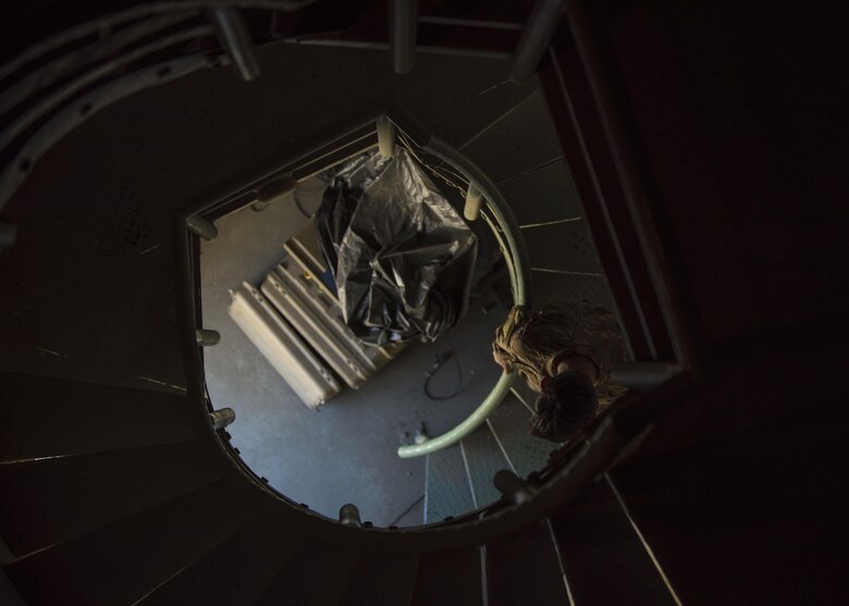 Airman 1st Class Angelena Legate, 455th Expeditionary Operations Support Squadron weather forecaster, walks down the staircase of a observation tower at Bagram Airfield, Afghanistan, May 16, 2016. Members of the 455th EOSS/OSW provide timely and accurate weather forecasts for aircrews, allowing flying units to plan and adjust mission requirements accordingly. (U.S. Air Force photo by Senior Airman Justyn M. Freeman)