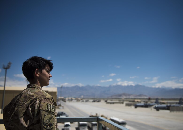 Airman 1st Class Angelena Legate, 455th Expeditionary Operations Support Squadron weather forecaster, looks over the flightline from an observation tower at Bagram Airfield, Afghanistan, May 16, 2016. Members of the 455th EOSS/OSW provide timely and accurate weather forecasts for aircrews, allowing flying units to plan and adjust mission requirements accordingly. (U.S. Air Force photo by Senior Airman Justyn M. Freeman)