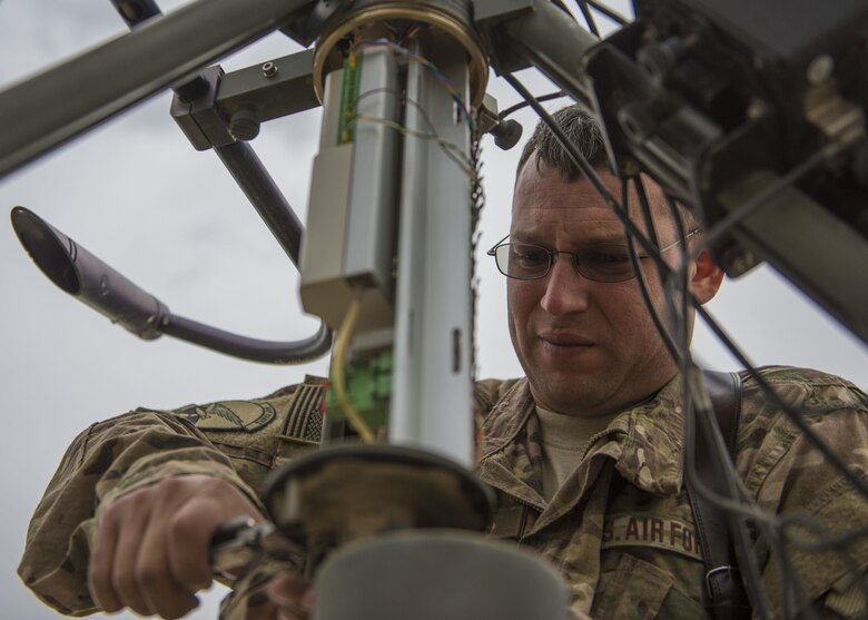 Technical Sgt. Heinz Disch, 455th Expeditionary Operations Support Squadron weather forecaster, tightens a bolt on a Tactical Meteorological Observation System or TMQ-53 at Bagram Airfield, Afghanistan, May 16, 2016. Members of the 455th EOSS/OSW provide timely and accurate weather forecasts for aircrews, allowing flying units to plan and adjust mission requirements accordingly. (U.S. Air Force photo by Senior Airman Justyn M. Freeman)