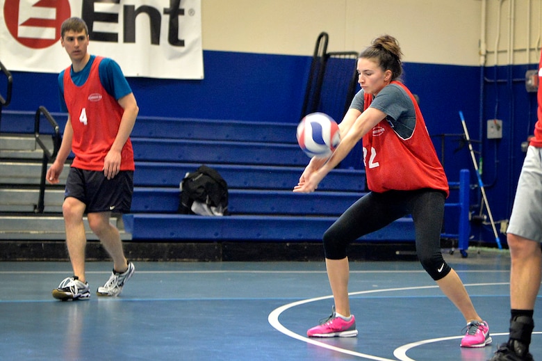 Carly Serratore, U.S. Air Force Warfare Center, receives a serve during the intramural volleyball championship game against the 22nd Space Operations Squadron at Schriever Air Force Base, Colorado, Wednesday, May 11, 2016. The USAFWC won with a 25-19 and 25-14 straight set sweep to claim its second consecutive championship. (U.S. Air Force photo/Katie Calvert)