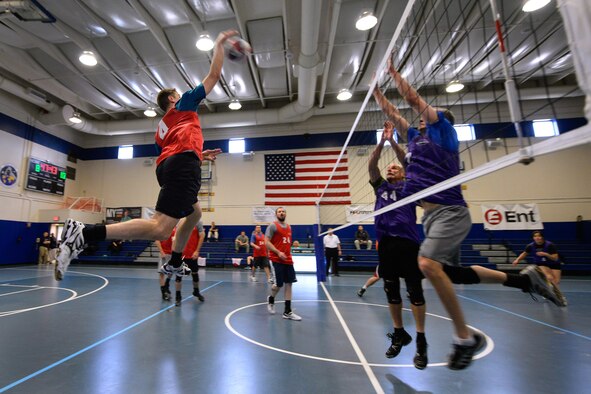 Jonathan Plyler, U.S. Air Force Warfare Center, spikes the ball during the intramural volleyball championship game against the 22nd Space Operations Squadron at Schriever Air Force Base, Colorado, Wednesday, May 11, 2016.  The USAFWC won the championship title for a second straight year, with a 25-19 and 25-14 straight set victory. (U.S. Air Force photo/Christopher DeWitt)