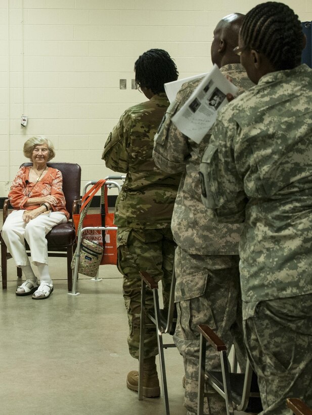 Eva Dukesz Friedlander, a Holocaust survivor, receives a standing ovation from over 100 soldiers of the 335th Signal Command (Theater), May 14, 2016 at East Point, Georgia. Friedlander shared her life story and how she survived the Holocaust at the Holocaust Day of Remembrance. During the 335th SC(T) battle assembly weekend, the Equal Opportunity Office conducted its annual observance of the National Day of Remembrance, which was established by Congress in 1980 to ensure the victims of the Holocaust are remembered forever. (U.S. Army photo by Sgt. Stephanie A. Hargett)