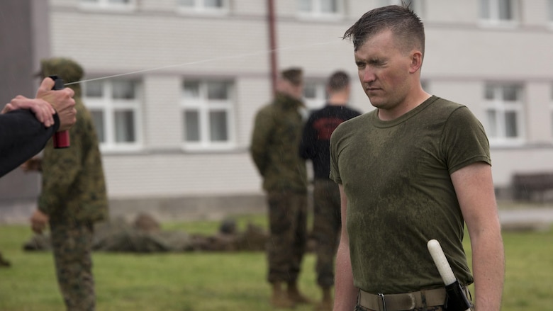 Cpl. Michael T. Langguth, a squad leader with 4th Law Enforcement Battalion, Force Headquarters Group, Marine Forces Reserve, participates in the oleoresin capsicum qualification training during exercise Platinum Wolf 16 at the Peacekeeping Operations Training Center South Base, Serbia, May 11, 2016. Platinum Wolf 16 is demonstrates the seamless integration of Reserve Marines with active component and enhances interoperability with partner nations in the region. 