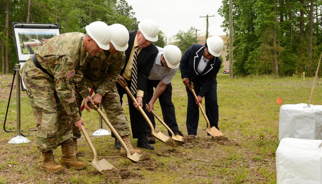 (L-R) Brig. Gen. Steven W. Ainsworth, commander 94th Training Division, Col. Paul K. Brooks U.S. Army Garrison Commander Fort Lee, Mr. John G. Royster, Master Planning Division branch chief, Department of Public Works Fort Lee, Mr. Anthony Weaver, Corps of Engineers Construction Lead, and Mrs. Betty Brown, team chief of The Army School System Training Center-Fort Lee break ground during a ceremony for a new training facility May 12, 2016. The 39,127-square-foot training center will be equipped with 15 classrooms and will include a maintenance training area for transportation courses, as well as a state of the art instructional kitchen for food service specialist courses. Ninety-fourth TD instructors could potentially train 2,635 Soldiers while teaching 120 classes annually.