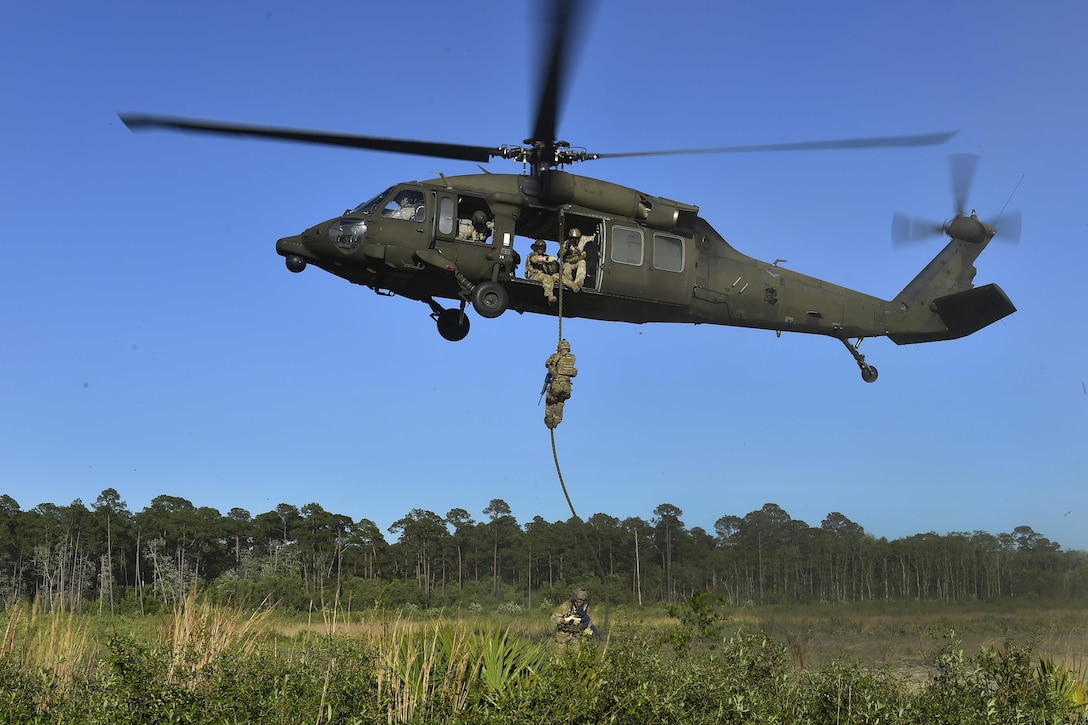 Airmen participate in fast-rope training from an Army UH-60 Black Hawk during Emerald Warrior at Hurlburt Field, Fla., May 4, 2016. Air Force photo by Senior Airman Jeff Parkinson