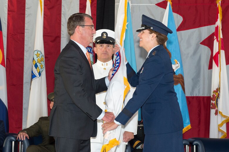 U.S. Air Force Gen. Lori J. Robinson receives the U.S. Northern Command guidon from the U.S. Secretary of Defense, Ashton B. Carter signifying her acceptance of command, May 13, 2016 on Peterson Air Force Base, Colo. Gen. Robinson is the seventh commander of USNORTHCOM since its inception on Oct 1, 2002. (DoD Photo by N-NC Public Affairs/Released)
