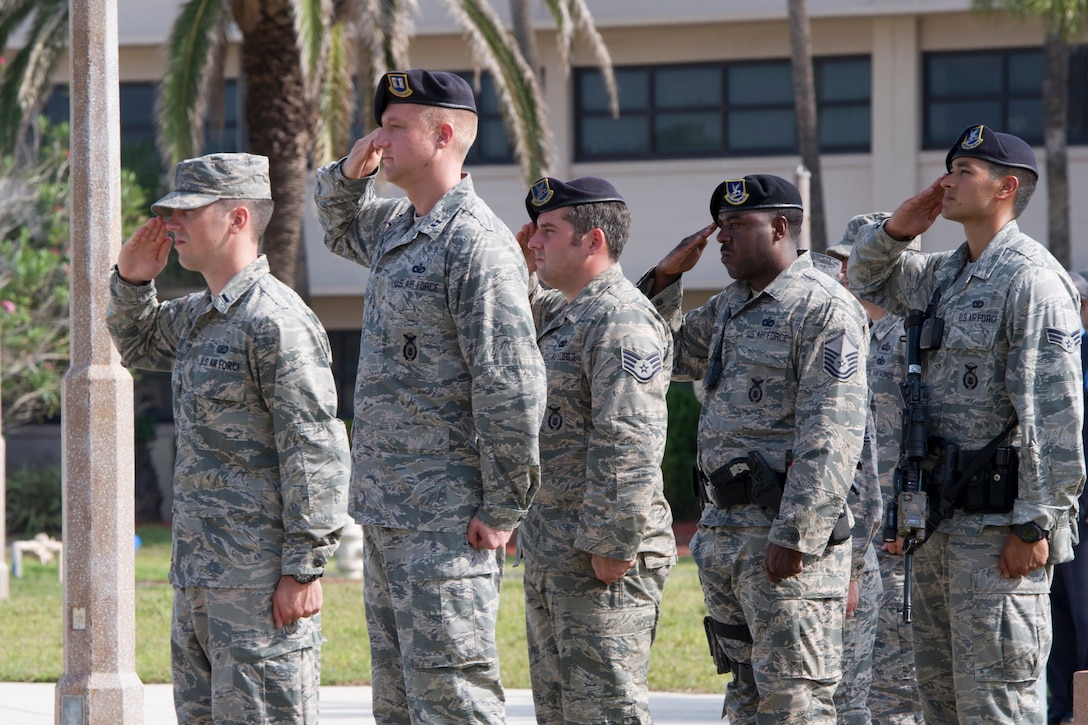 The 45th Security Forces Squadron honored all law enforcement and first responders who have made the ultimate sacrifice during the National Police Week Opening and Fallen Heroes Ceremony May 16, 2016, at Patrick Air Force Base, Fla. This year’s National Police Week dates are held May 15-21, 2016. A SFS Open House is scheduled for May 18, which includes a Military Working Dog demonstration. Guests can also see the holding cells, dispatch center, mobile command post, weapons display, and patrol vehicle from 2-4 p.m. in building 1319. The open house is open to those with a valid DOD identification card. Additionally, a Wing Run is slated for May 20 at 7 a.m. at the WarFit Field. All members have the option to complete a 2-mile or 5K ruck march instead of 5K run. For more information, call (321) 494-6949/6270. (U.S. Air Force photos/Matthew Jurgens/Released)