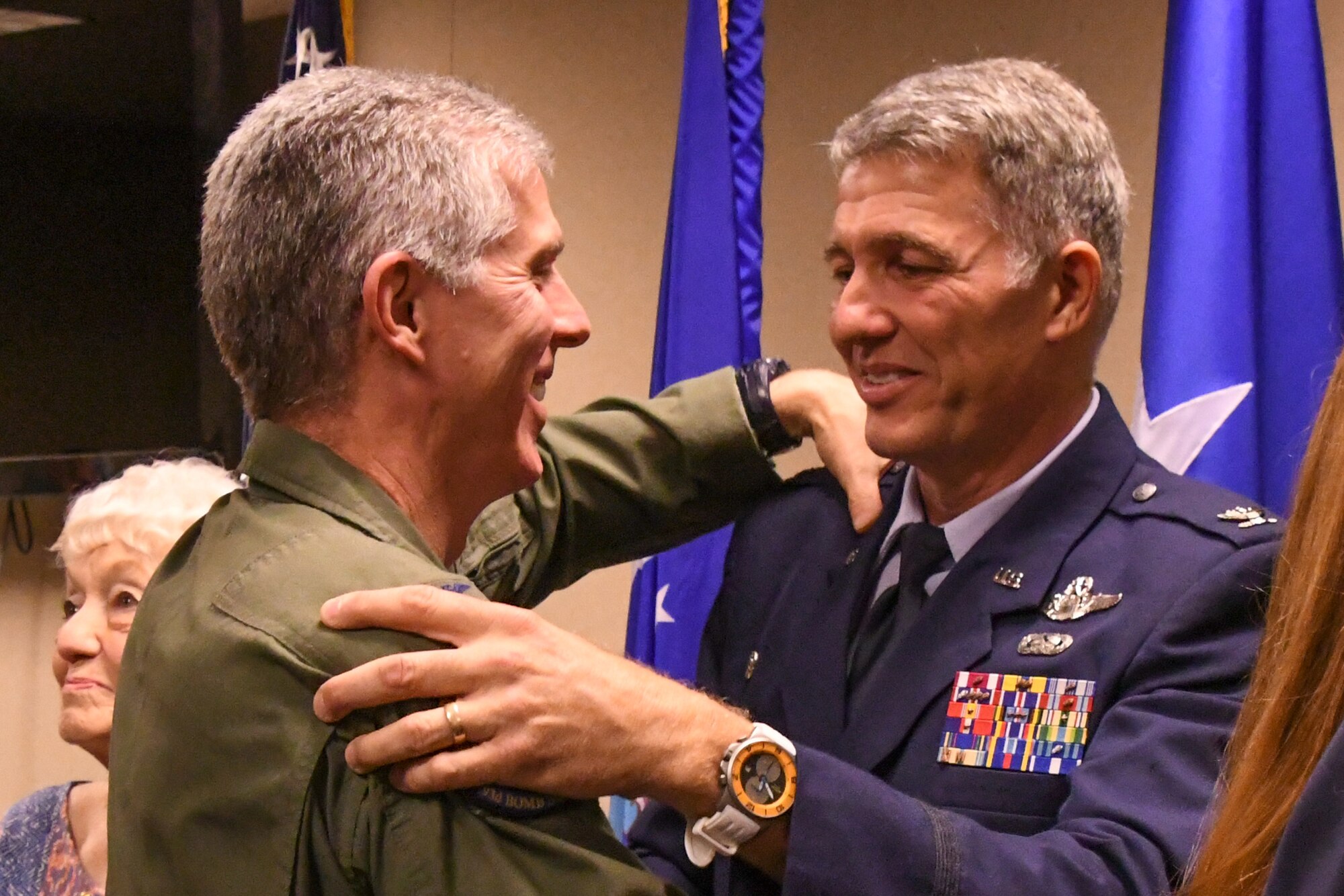 U.S. Air Force Col. James Morriss, the vice commander of the 307th Bomb Wing, congratulates Col. Robert VanHoy on his promotion to colonel on May 15, 2016 on Barksdale Air Force Base, La. VanHoy is the commander of the 93rd Bomb Squadron and a command pilot with over 4,000 flight hours. (U.S. Air Force photo by Master Sgt. Dachelle Melville/Released)