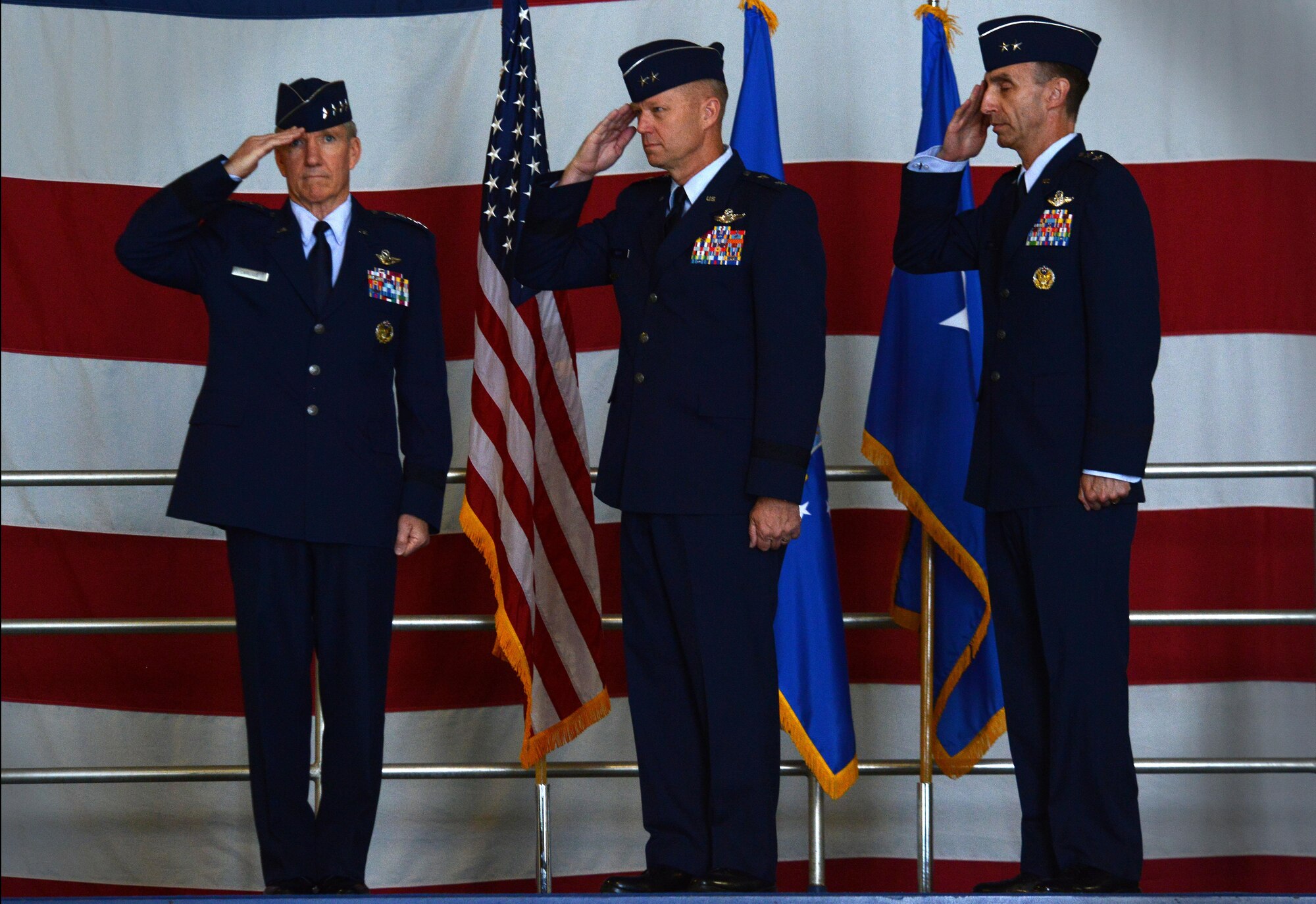 U.S. Air Force Gen. Hawk Carlisle, left, Air Combat Command commander, is saluted by Maj. Gen. Mark Kelly, center, outgoing Ninth Air Force commander, and Maj. Gen. Scott Zobrist, right, incoming Ninth Air Force commander, during the playing of “Ruffles and Flourishes” at a change of command ceremony at Shaw Air Force Base, S.C., May 17, 2016. Airmen, Soldiers, and community leaders attended the ceremony to show support for the incoming and outgoing commanders. (U.S. Air Force photo by Airman 1st Class Kelsey Tucker)