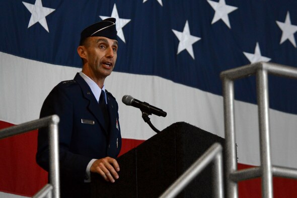 U.S. Air Force Gen. Hawk Carlisle, Air Combat Command commander, passes the Ninth Air Force guidon to Maj. Gen. Scott Zobrist, incoming Ninth Air Force commander, during a change of command ceremony at Shaw Air Force Base, S.C., May 17, 2016. The passing of the guidon is a time-honored tradition symbolizing the transfer of authority from the previous commander to the new commander. (U.S. Air Force photo by Airman 1st Class Kelsey Tucker)