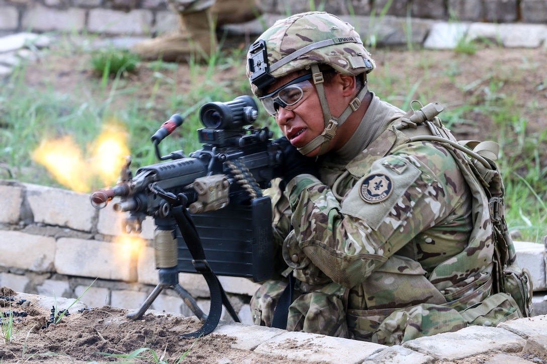 Army Spc. Patrick Metteba fires an M249 Squad Automatic Weapon during the blank-fire phase of a live-fire exercise, part of Exercise Hunter, at General Silvestras Zukauskas Training Area in Pabrade, Lithuania, May 11, 2016. Metteba is an infantryman with Ghost Troop, 2nd Squadron, 2nd Cavalry Regiment. Army photo by Staff Sgt. Michael Behlin