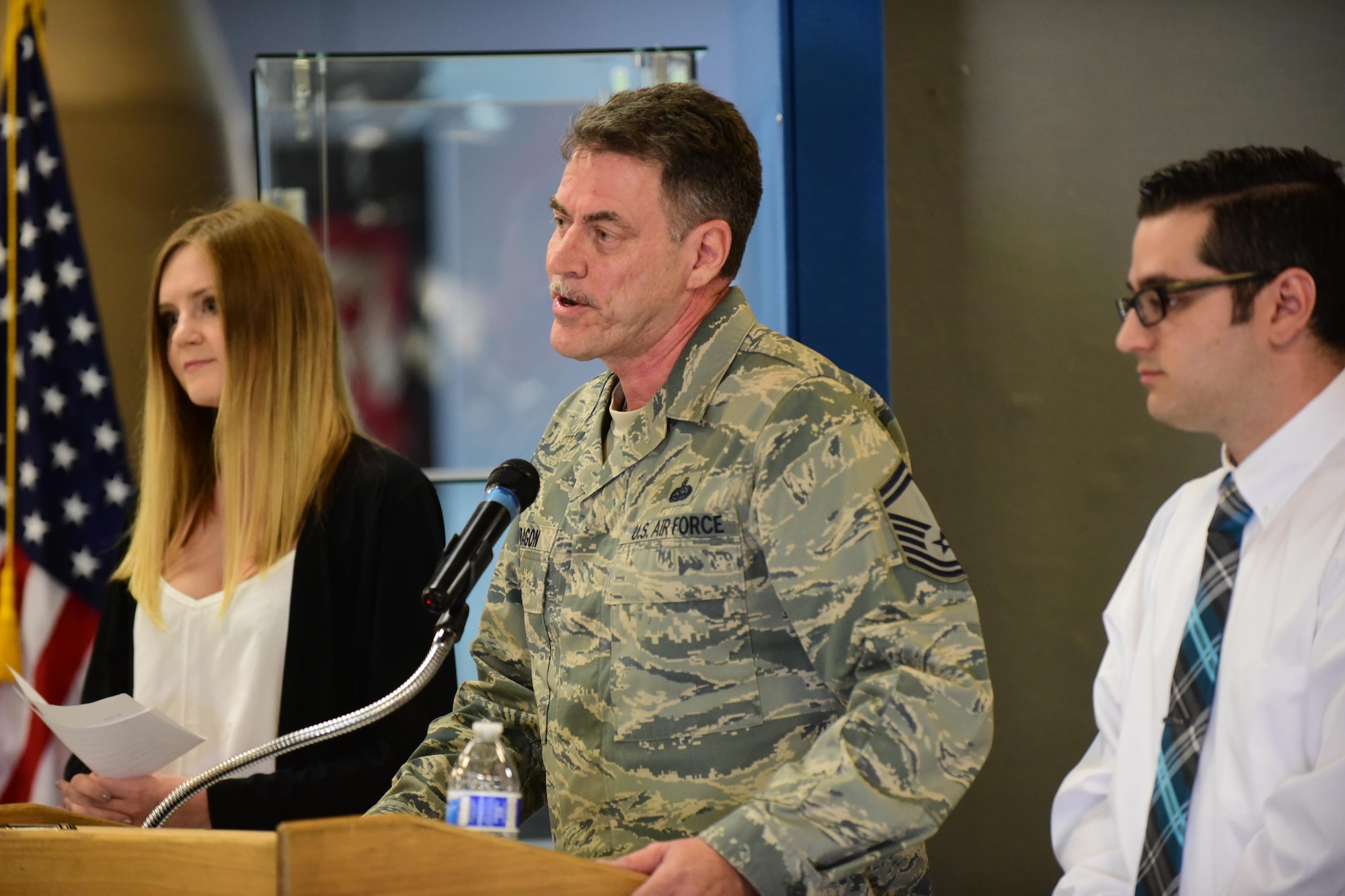 Senior Master Sgt. Mark Aragon is joined by his children as he speaks at the opening of the Peterson Air and Space Museum’s new exhibit featuring his father Staff Sgt. Jose Aragon, May 16, 2016.  Staff Sgt. Jose Aragon, a Colorado native, was killed during the Vietnam War and posthumously awarded the Bronze Star for his actions while serving at Bien Hoa Air Base, Vietnam.  (U.S. Air Force photo by Staff Sgt. Amber Grimm)
