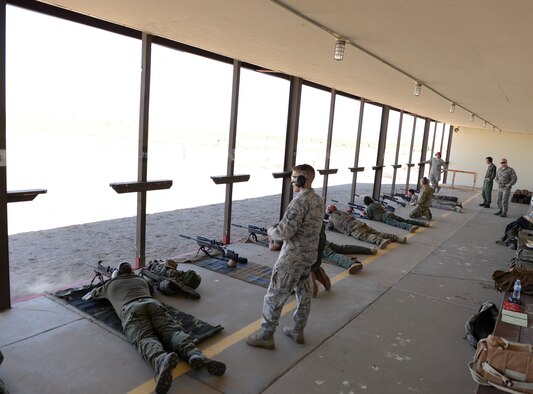 366th Security Forces members monitor local officers during a firing session April 20, 2016, at Mountain Home Air Force Base, Idaho. The officers had the chance to shoot targets from distances of 100-900 yards. (U.S. Air Force photo by Airman 1st Class Chester Mientkiewicz/Released)