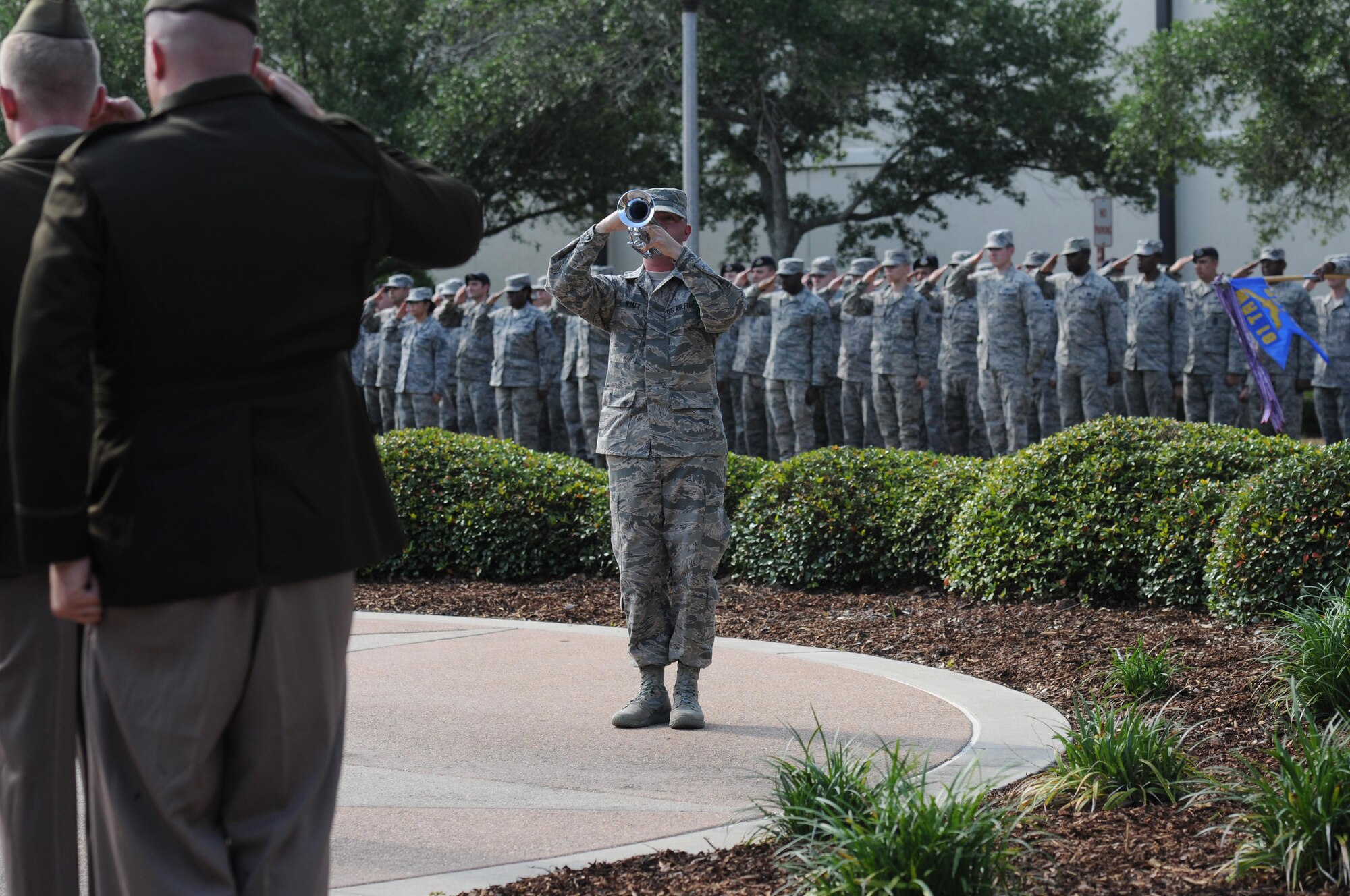 Airman 1st Class Robert Wyatt, 338th Training Squadron student, plays taps during the Lt. Samuel Reeves Keesler, Jr. Memorial Retreat Ceremony May 13, 2016, Keesler Air Force Base, Miss. The event was held in honor of Lt. Keesler’s date of entry into the Army Air Service 99 years ago. The retreat ceremony is part of a year-long celebration of Lt. Keesler, a Mississippi native and WORLD WAR I hero, and the 75th anniversary of the opening of the base. (U.S. Air Force photo by Kemberly Groue)