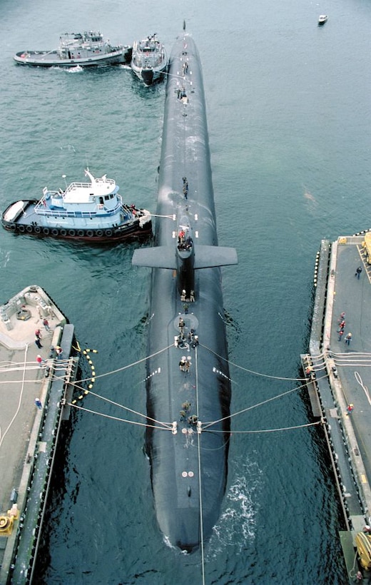 Submarine Base, Bangor, WA (Aug. 15, 1998) -- The U.S. Navy's Trident nuclear powered submarine USS Alaska (SSBN 732) is guided into an explosives handling wharf at the Naval Station.  U.S. Navy photo by Gene Royer. (RELEASED)