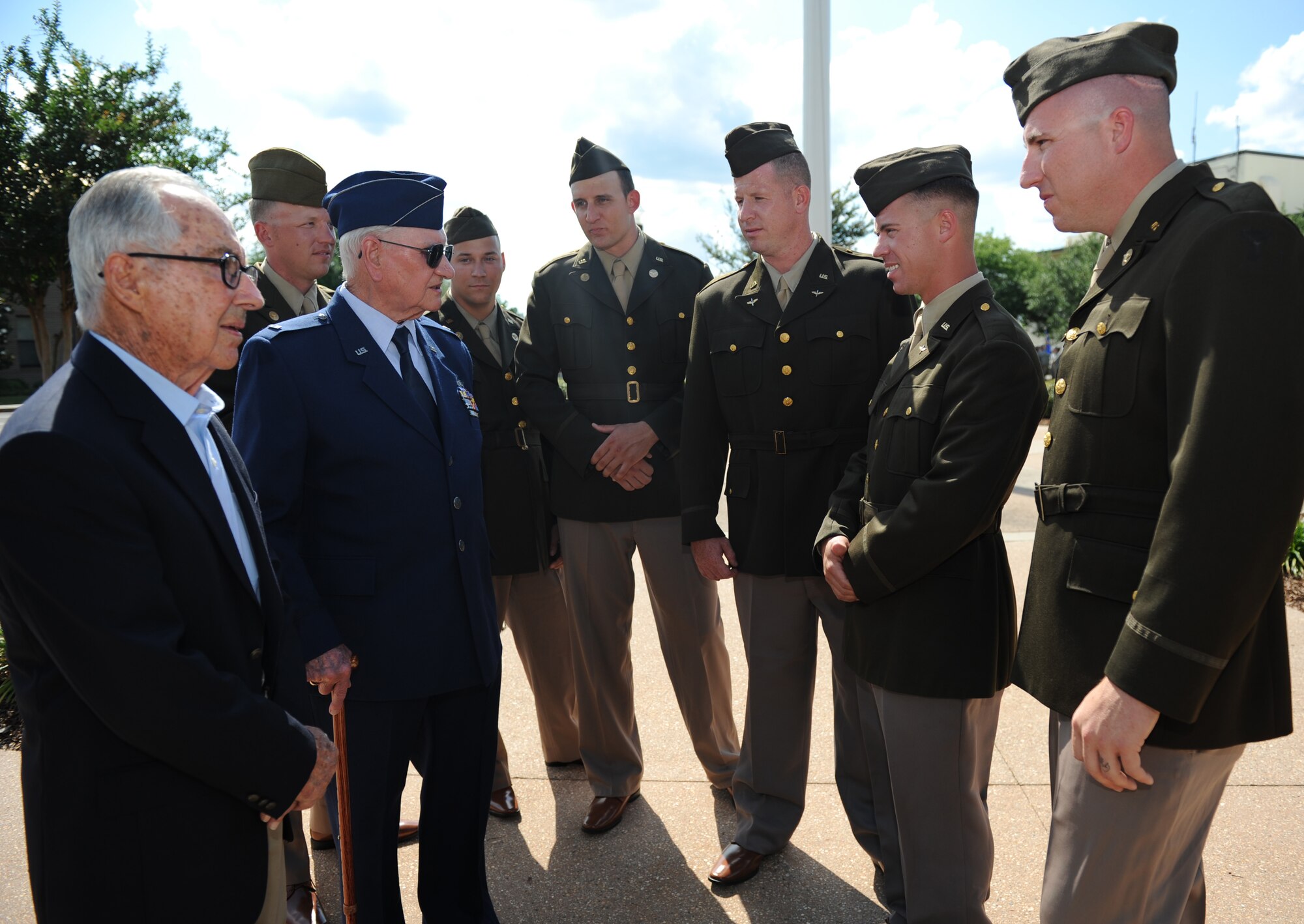 Lt. Col. Henry Burkle and Chief Warrant Officer Thomas Adams, Jr., both retired and stationed at Keesler during WORLD WAR II, speak to 81st Security Forces Squadron Combat Arms Training and Maintenance members during the Lt. Samuel Reeves Keesler, Jr. Memorial Retreat Ceremony May 13, 2016, Keesler Air Force Base, Miss. The event was held in honor of Lt. Keesler’s date of entry into the Army Air Service 99 years ago. The retreat ceremony is part of a year-long celebration of Lt. Keesler, a Mississippi native and WORLD WAR I hero, and the 75th anniversary of the opening of the base. (U.S. Air Force photo by Kemberly Groue)