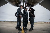 U.S. Navy Sailors from VAQ-137, Naval Air Station Whidbey Island, Washington, inspect the engine exhaust of an EA-18G Growler electronic attack aircraft prior to a sortie May 9, 2016 during RED-FLAG-Alaska (RF-A) 16-1 at Eielson Air Force Base, Alaska. Without the expertise of maintenance Sailors, pilots from VAQ-137 wouldn’t be able to fulfill their mission to provide the best airborne electronic warfare from the sea. (U.S. Air Force photo by Staff Sgt. Shawn Nickel/Released)
